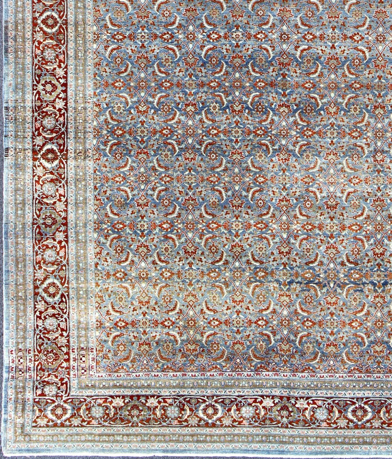 Red and light blue vintage Persian Tabriz rug with free flowing floral design, rug zir-3, country of origin / type: Iran / Tabriz, circa 1910

This magnificent early 20th century Persian Tabriz rug bears a beautiful, all-over, free-flowing Herati