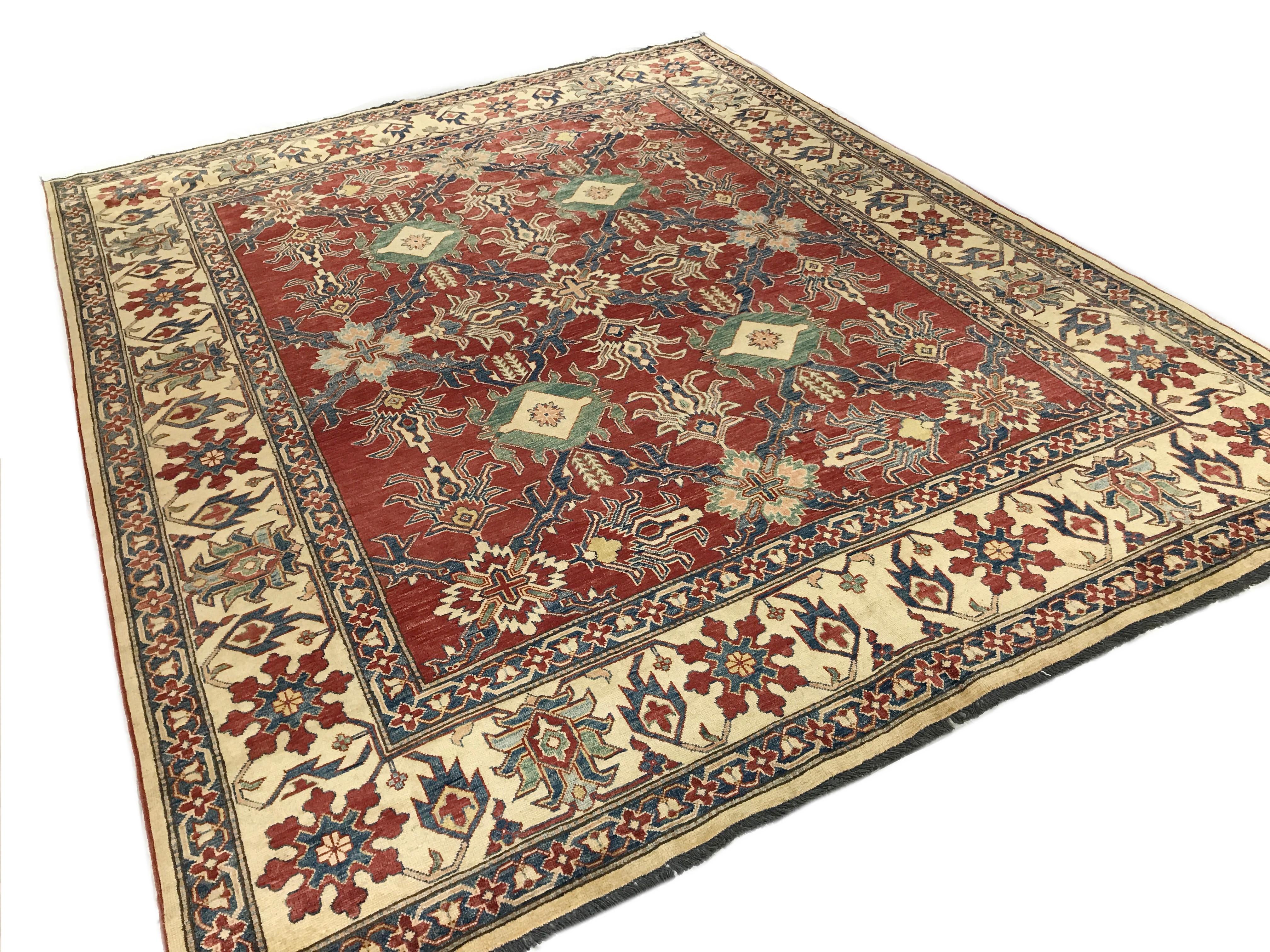 Red and blue traditional wool area rug - 8'1