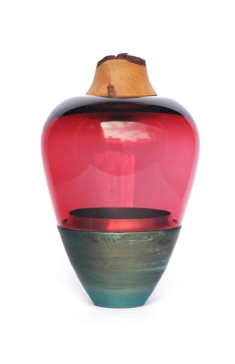 Red and Copper Patina India Vessel I, Pia Wüstenberg
Dimensions: D 20 x H 38
Materials: glass, wood, copper
Available in other metal: brass, copper, copper patina

Handmade in Europe, by individual craftsmen: handblown glass (Czech Republic), hand