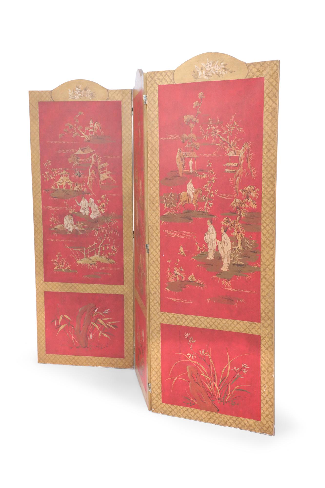 Red folding screen comprised of three panels framed in gold lattice patterns, topped with oval medallions featuring bouquets, and painted with traditional Chinoiserie designs of pagodas, nature and figures in pastoral settings.