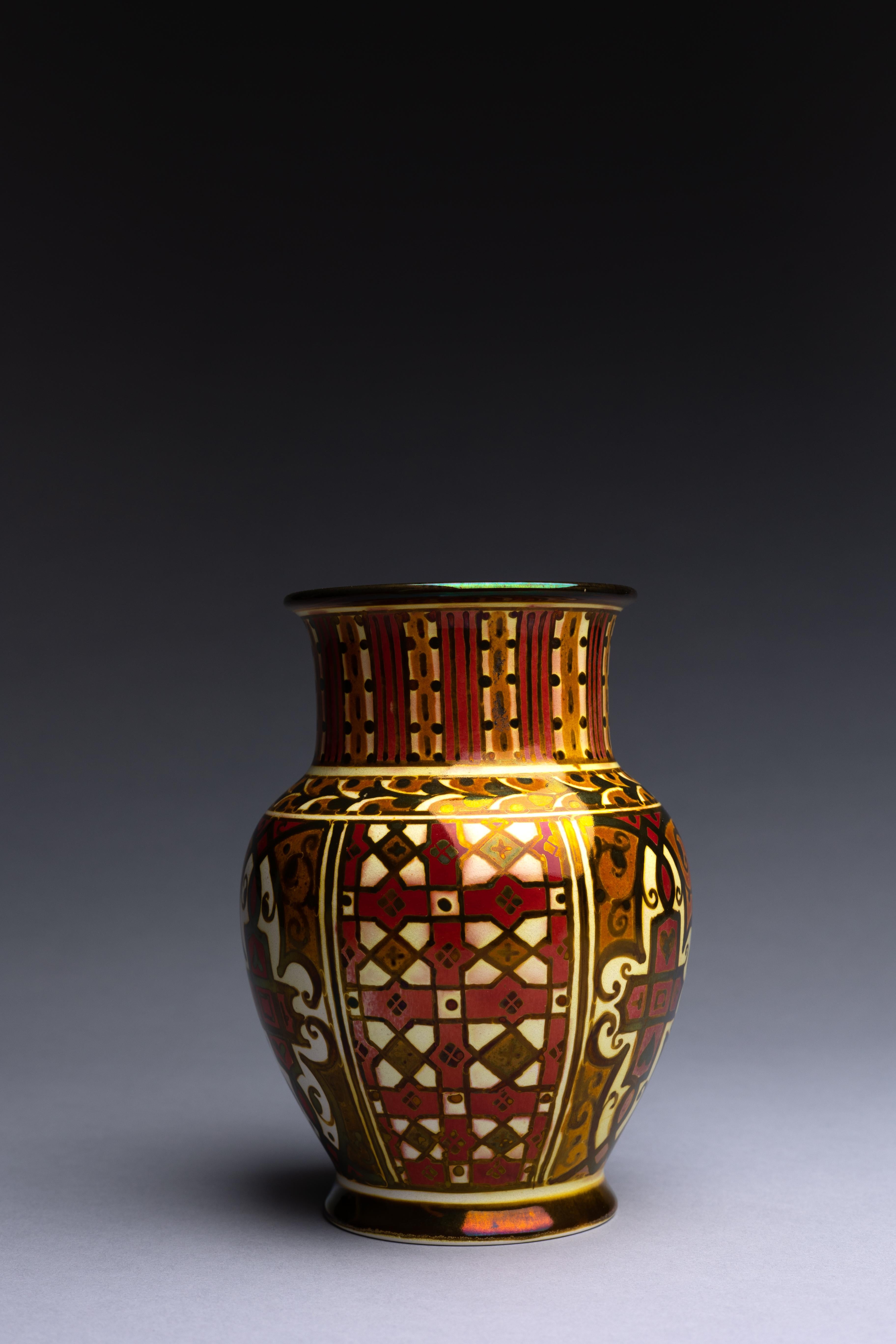 William S. Mycock for Pilkingtons Royal Lancastrian Pottery, a vase in stunning gold and ruby lustre glazes, created in 1920 in the dawn of the Art Deco style.

William Mycock’s gold and ruby lustre vase is emblematic of the high-quality