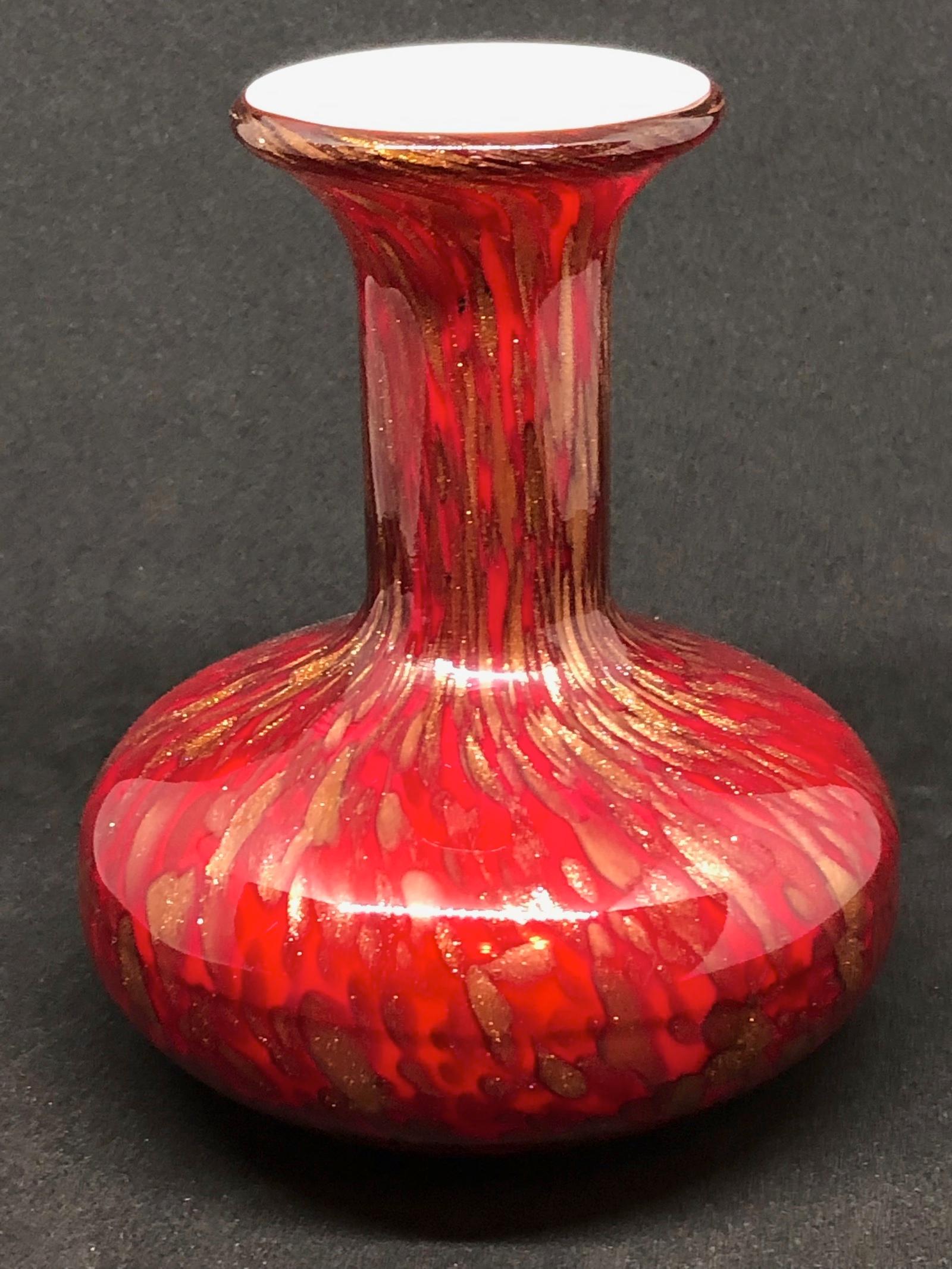 Beautiful Murano hand blown Italian art glass vase. Created by a Barovier Toso company. Brilliant Red color with golden glitter. A beautiful piece of art for any room.