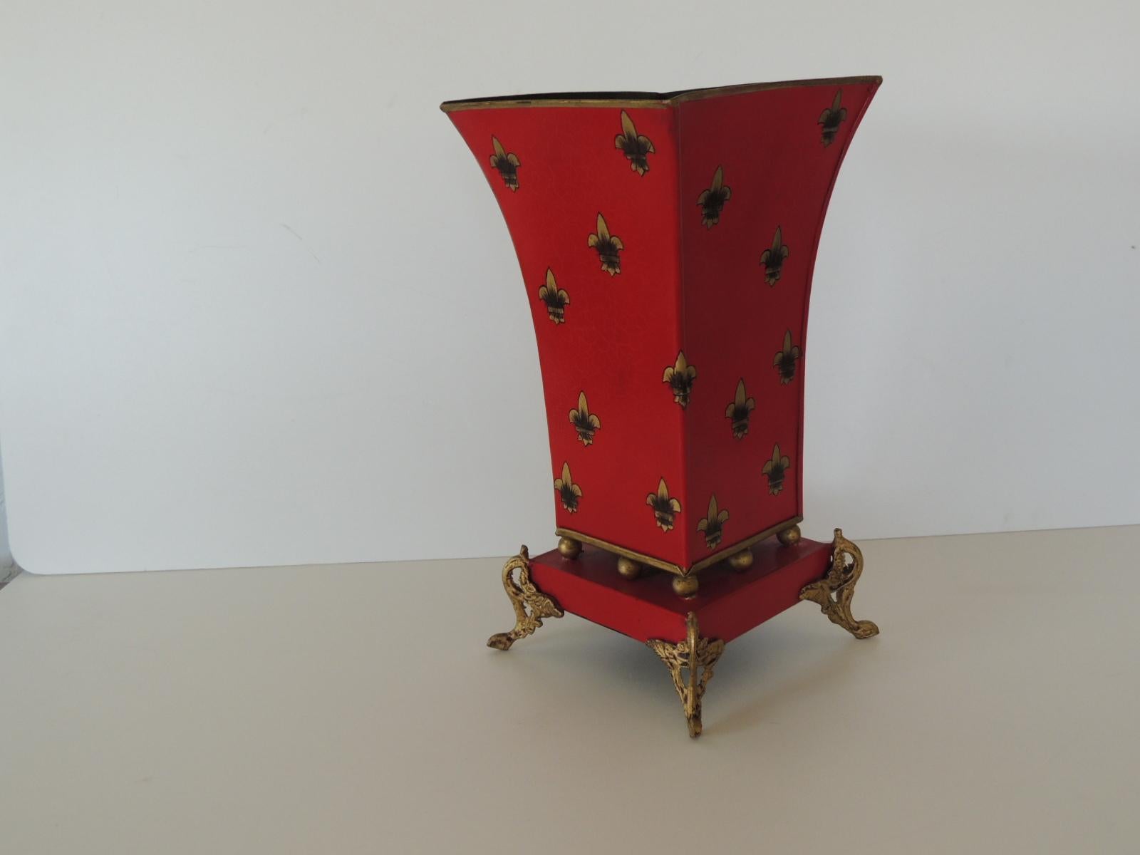 Red and gold tall cachepot with fleur-de-lis design.
Tall urn with ball details and brass scrolling feet.
Size: 7” W x 7