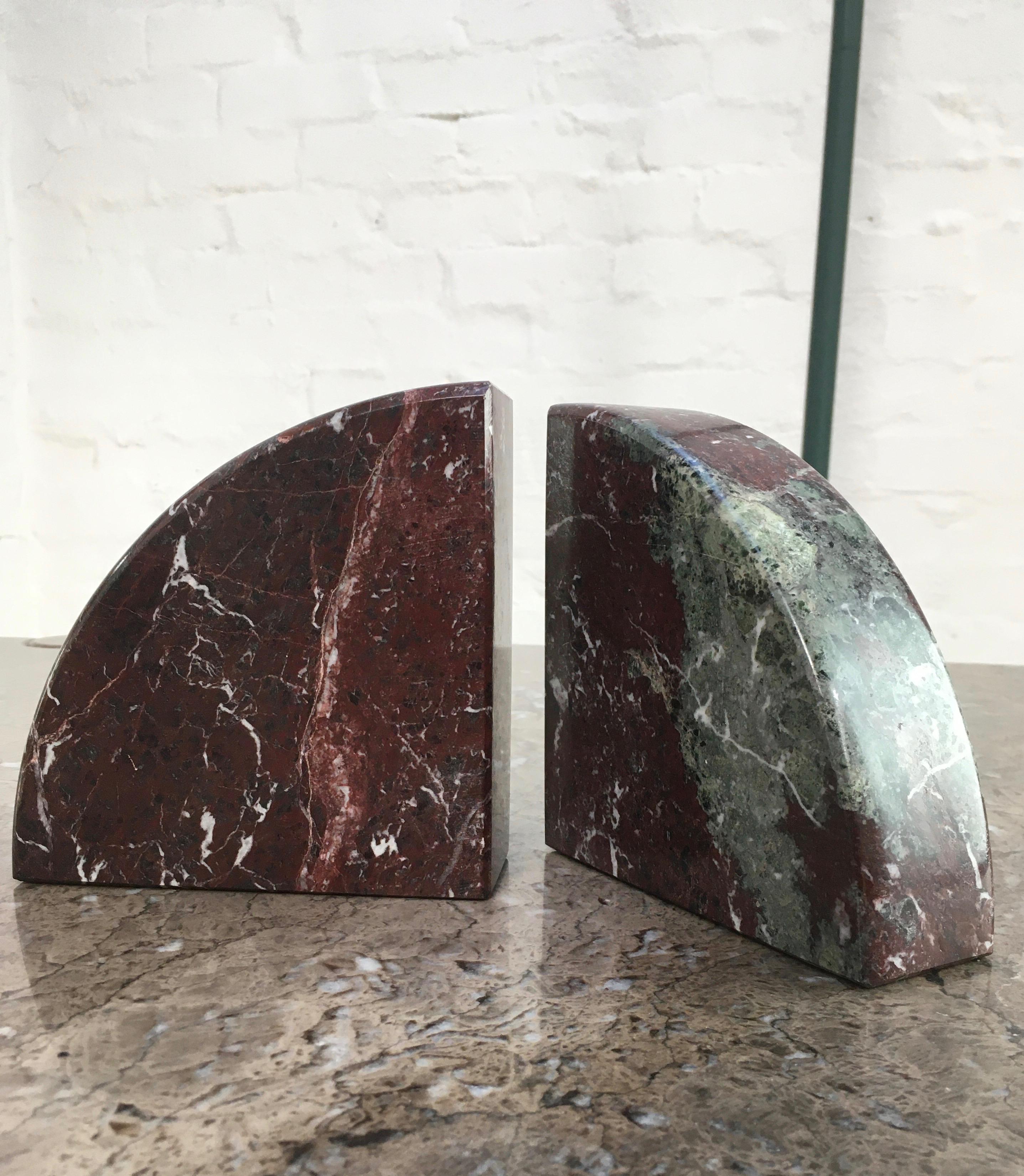 A pair of substantial bookends with great decorative appeal. These quadrant bookends can hold up a good heft of books but not too heavy to be easily handled and moved about to create the best decorative effect.

The deep reds and grey-greens in