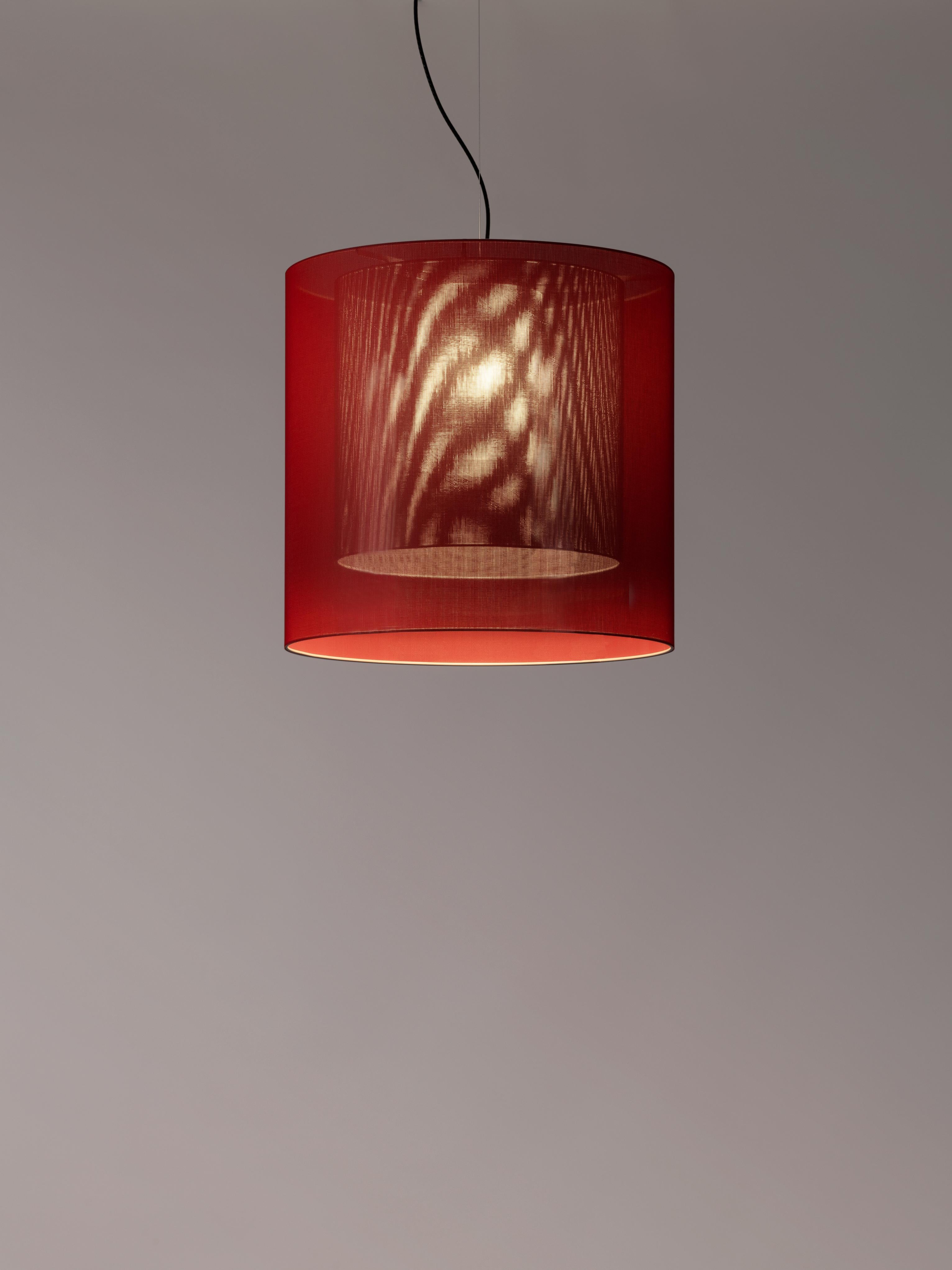 Red and grey moaré lm pendant lamp by Antoni Arola
Dimensions: d 62 x h 60 cm
Materials: Metal, polyester.
Available in other colors and sizes.

Moaré’s multiple combinations of formats and colors make it highly versatile. The series takes its