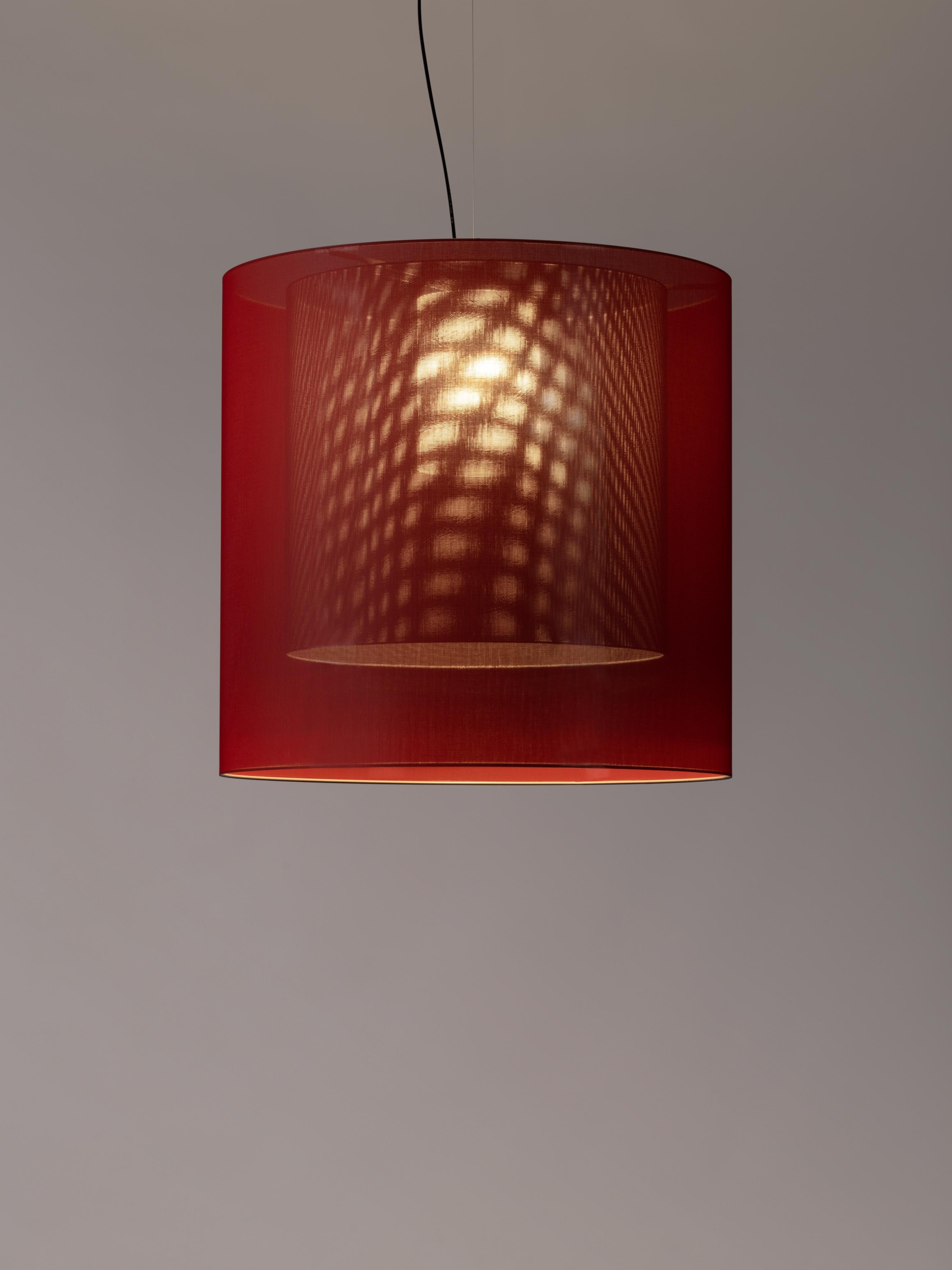 Red and grey moaré XL pendant lamp by Antoni Arola
Dimensions: D 83 x H 81 cm
Materials: Metal, polyester.
Available in other colors and sizes.

Moaré’s multiple combinations of formats and colours make it highly versatile. The series takes its
