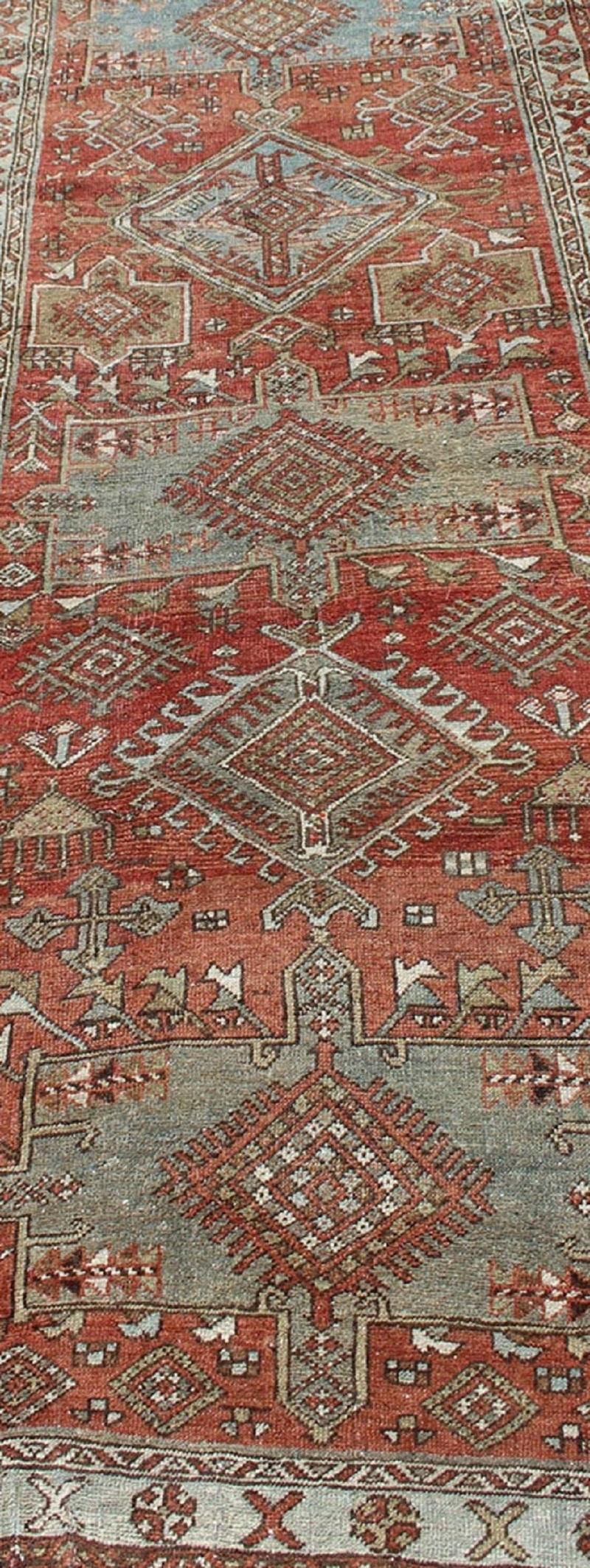 Early 20th Century Red and Light Blue-Gray Toned Antique Persian Heriz Gallery Rug with Medallions For Sale