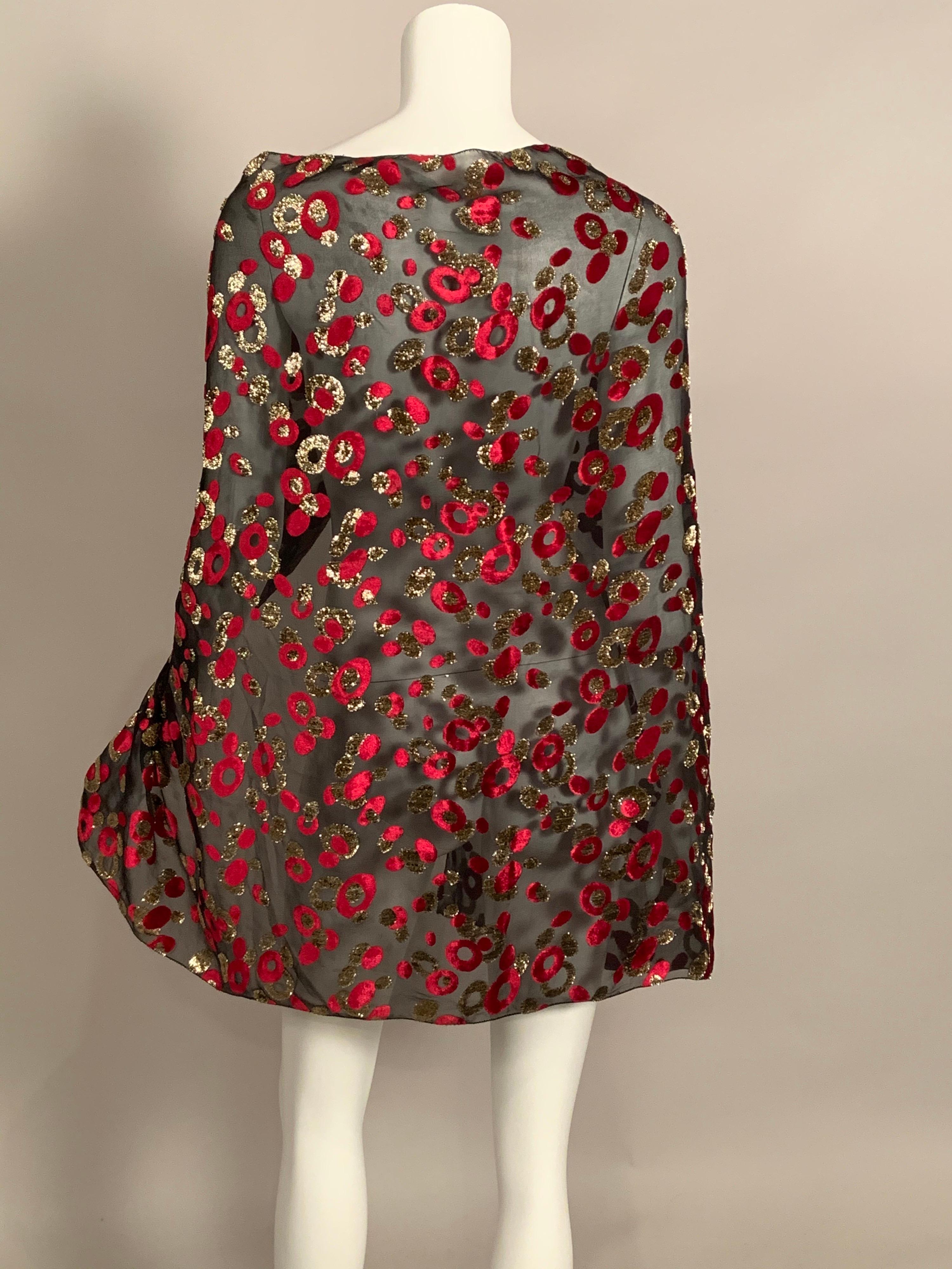 This beautiful shawl has a delicate black silk chiffon base with red and metallic gold velvet circles and dots adding color and whimsy. One size fits all and it is in excellent condition.
Measurements; Length 52