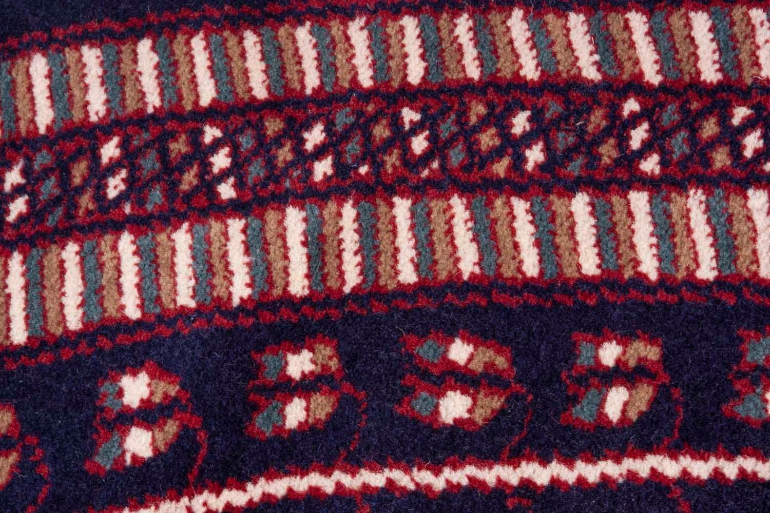Handsome Kashmir navy blue and red Indian carpet
Tribal 8' round pattern has been spotted at the White House
Purchased on our fall buying trip to India along with a sister rug of another color palatte.

 
