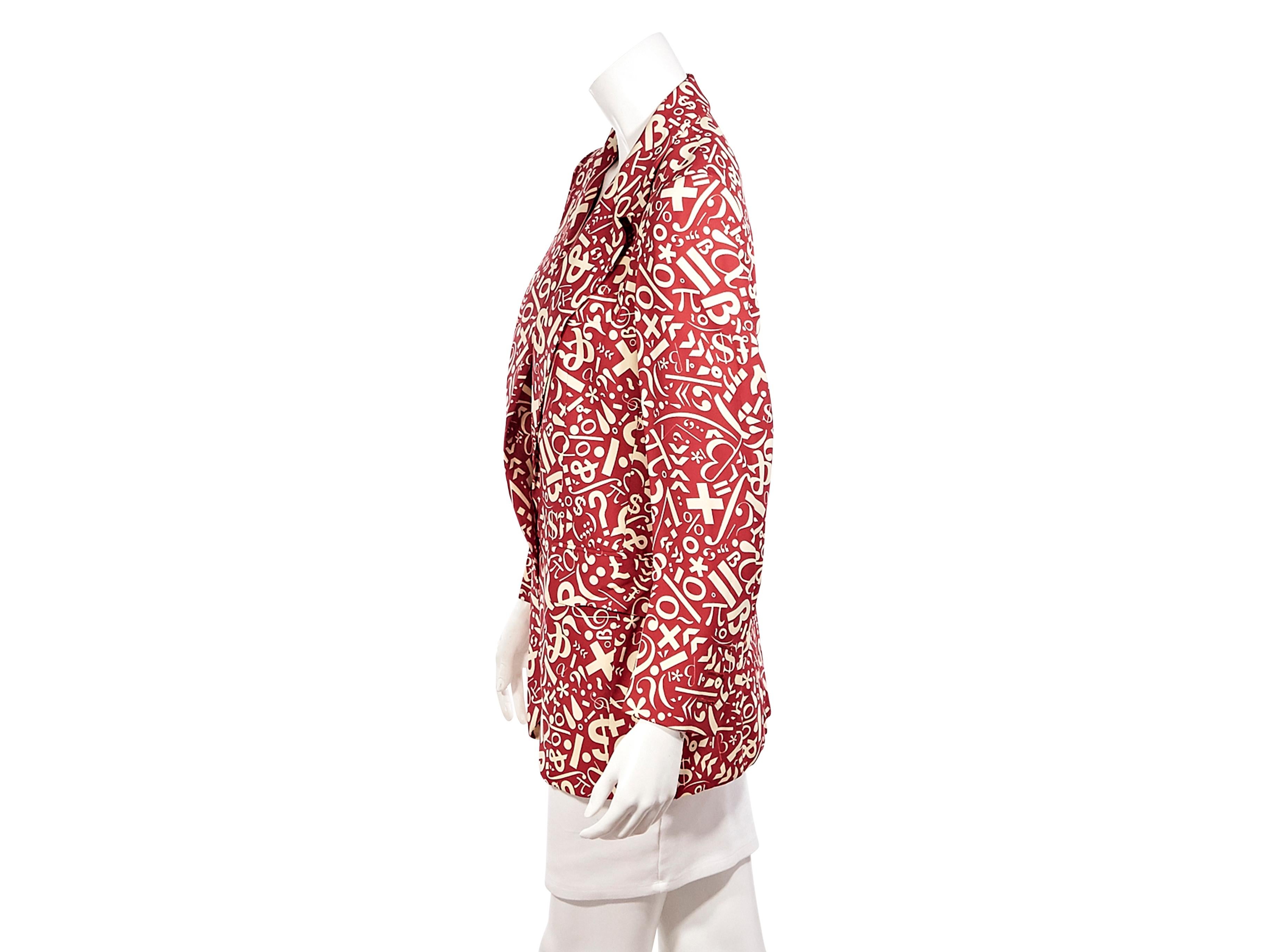 Product details:  Vintage red and white silk printed blazer by Cheap and Chic by Moschino.  Peak lapels. Long sleeves. Gold-tone embossed single-button closure. Dual waist flap pockets. Back center hem vent. Roll the sleeves up over a T-shirt. Label