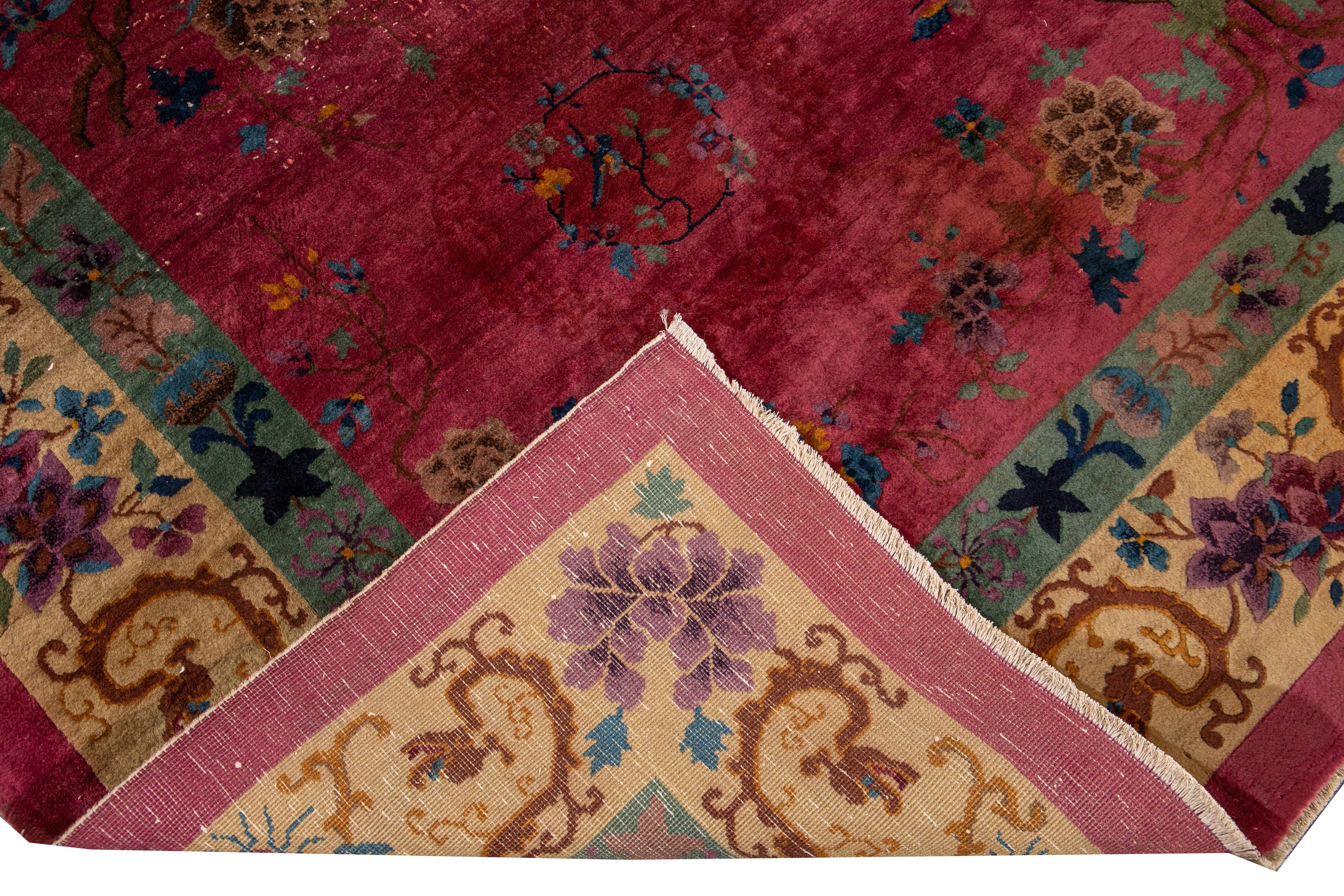 Beautiful vintage Art Deco Chinese hand knotted wool rug with a red field. This Art Deco rug has multi-color accents in a gorgeous all-over floral Chinese design.

This rug measures: 8'11
