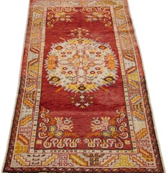 Red Antique Handmade Khotan Wool Rug with Medallion Motif