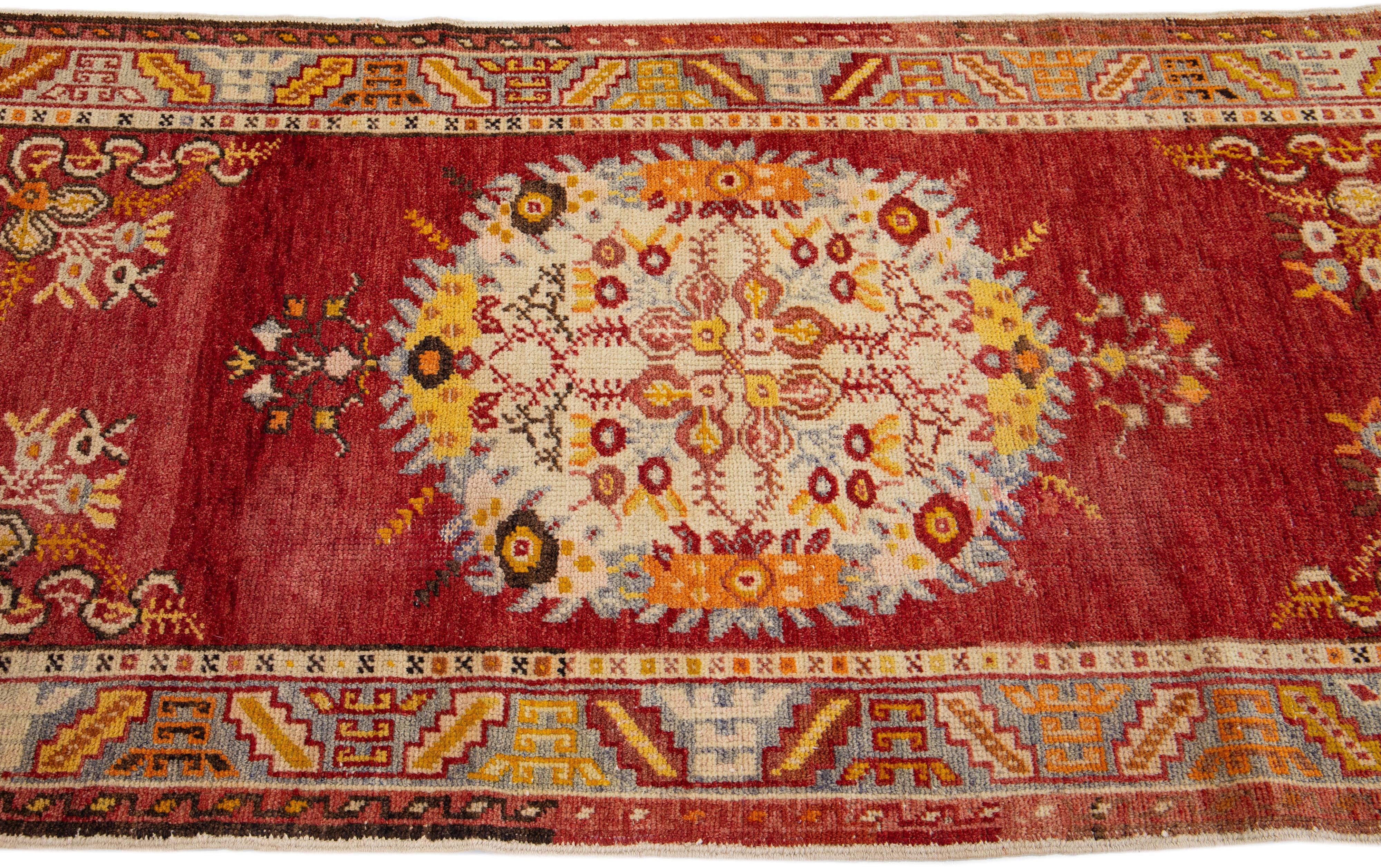 Hand-Knotted Red Antique Handmade Khotan Wool Rug with Medallion Motif For Sale
