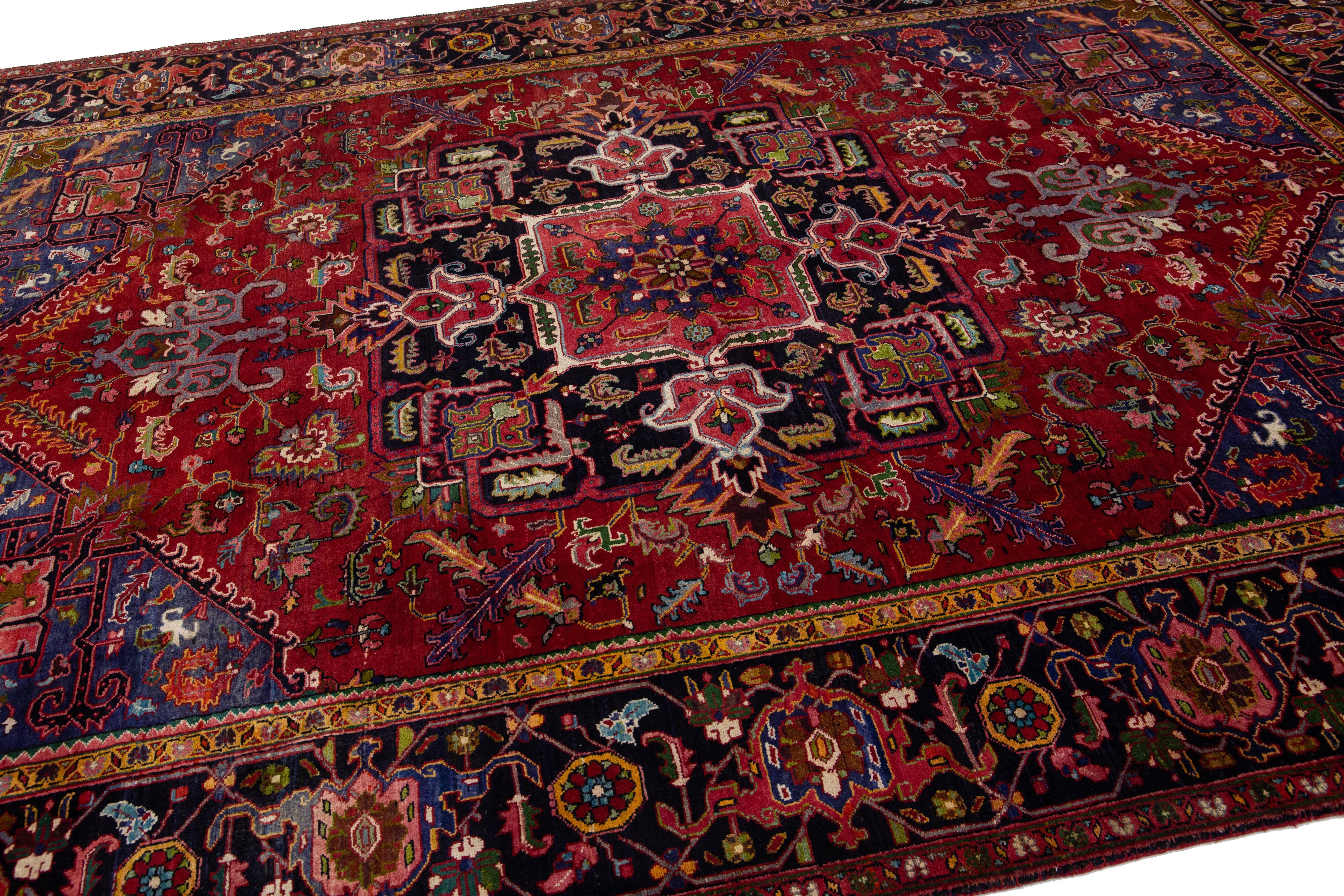 Hand-Knotted Red Antique Heriz Handmade Persian Wool Rug with Allover Multicolor Motif For Sale