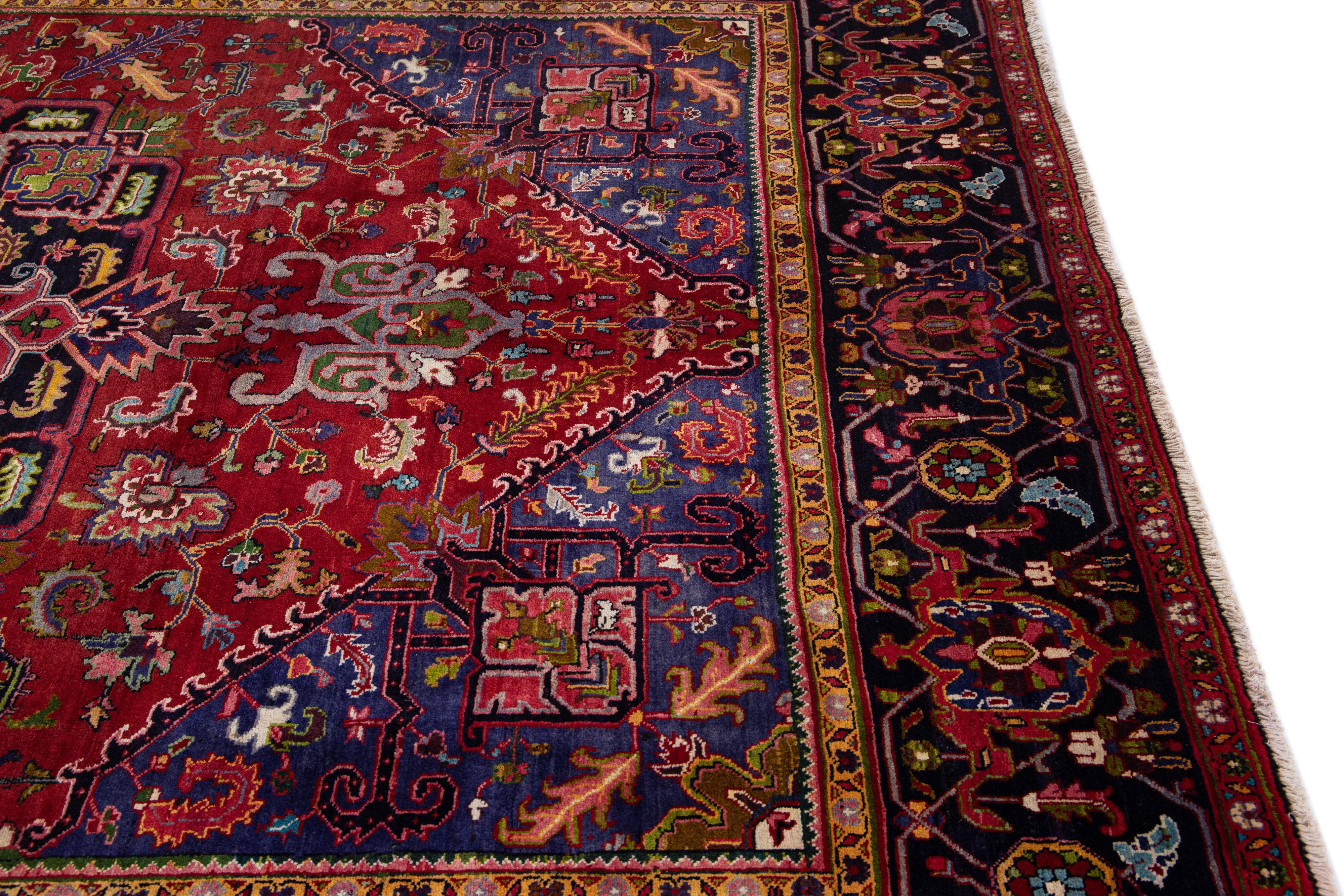 20th Century Red Antique Heriz Handmade Persian Wool Rug with Allover Multicolor Motif For Sale