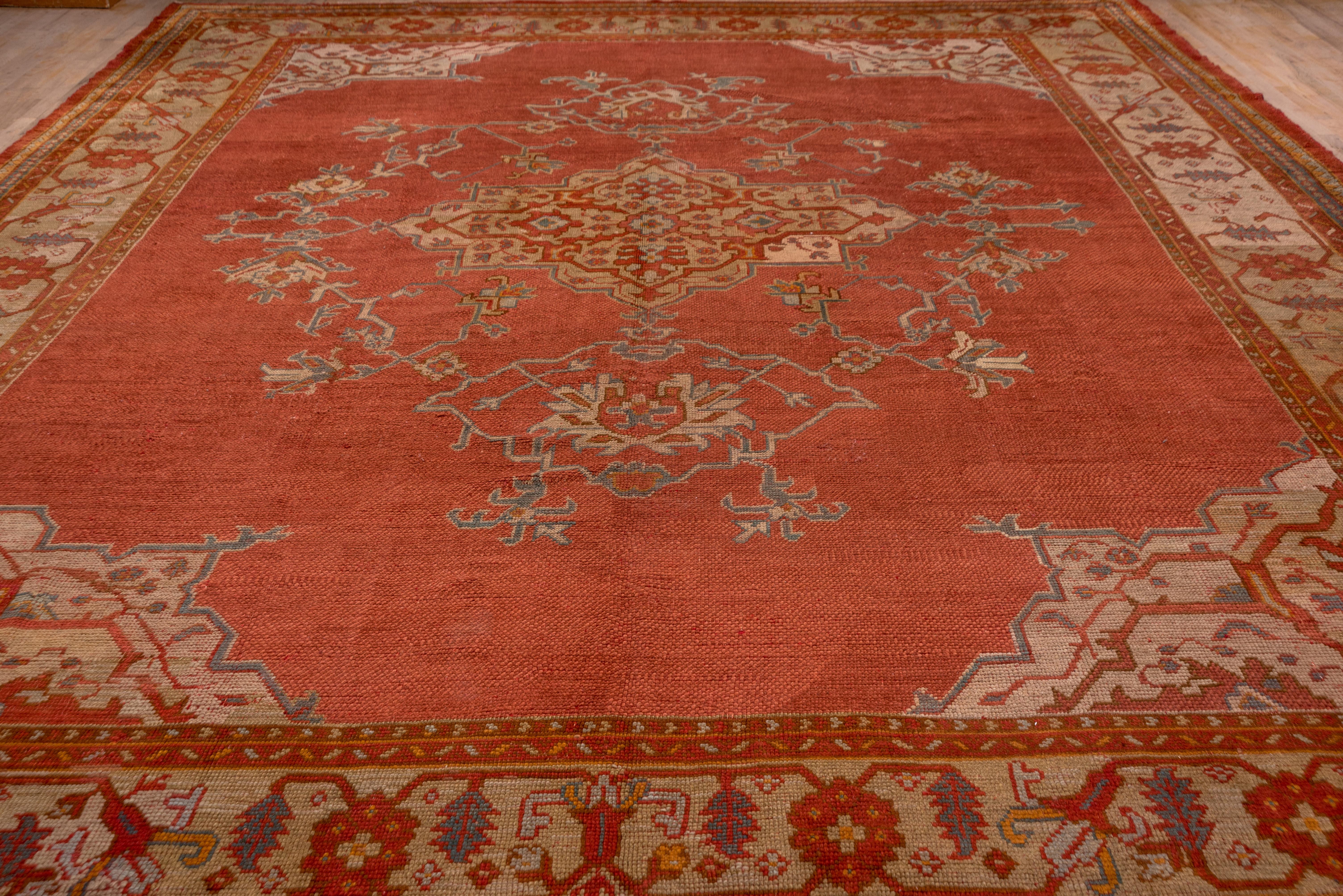 The Turkey red field displays an arabesque filled octogramme medallion with enormous pendants enclosing Classic palmettes with corner pieces en suite to the medallion. The green border,medallion and corners are all in the same chromatic key..