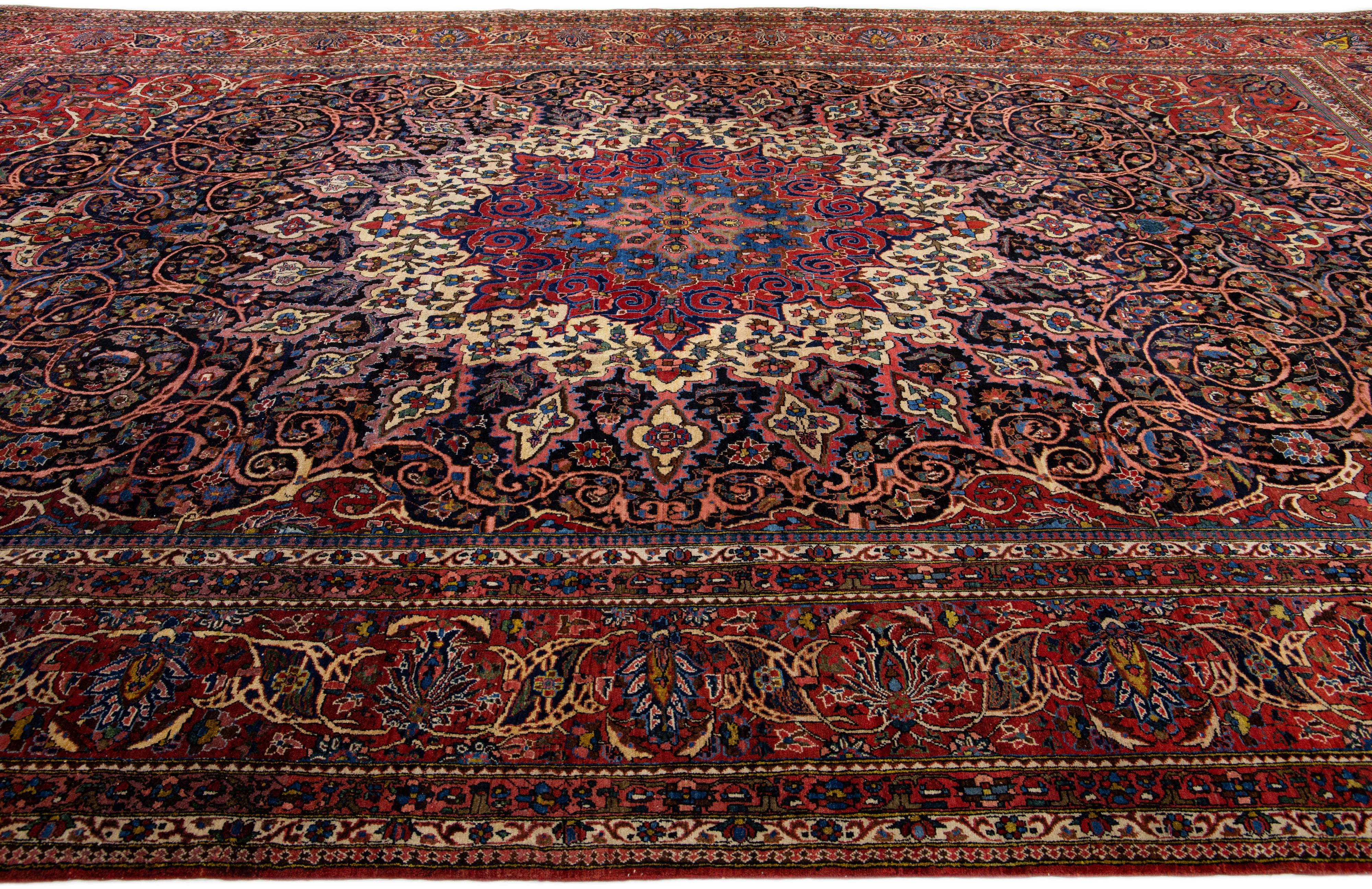 Red Antique Persian Bakhtiari Handmade Oversize Wool Rug with Rosette Pattern In Good Condition For Sale In Norwalk, CT
