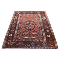 Tapis persan ancien Heriz rouge noué à la main en pure laine en excellent état