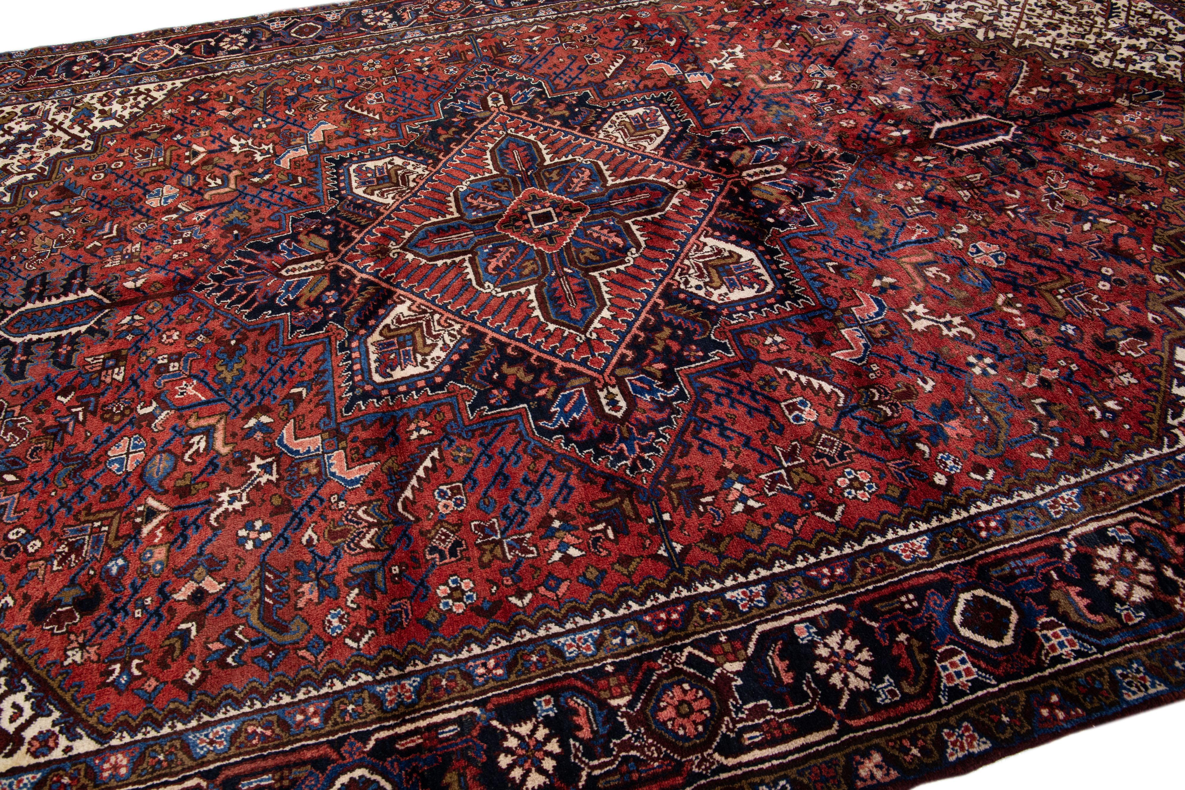 Hand-Knotted Red Antique Persian Heriz Handmade Gallery Wool Rug with Medallion Motif For Sale