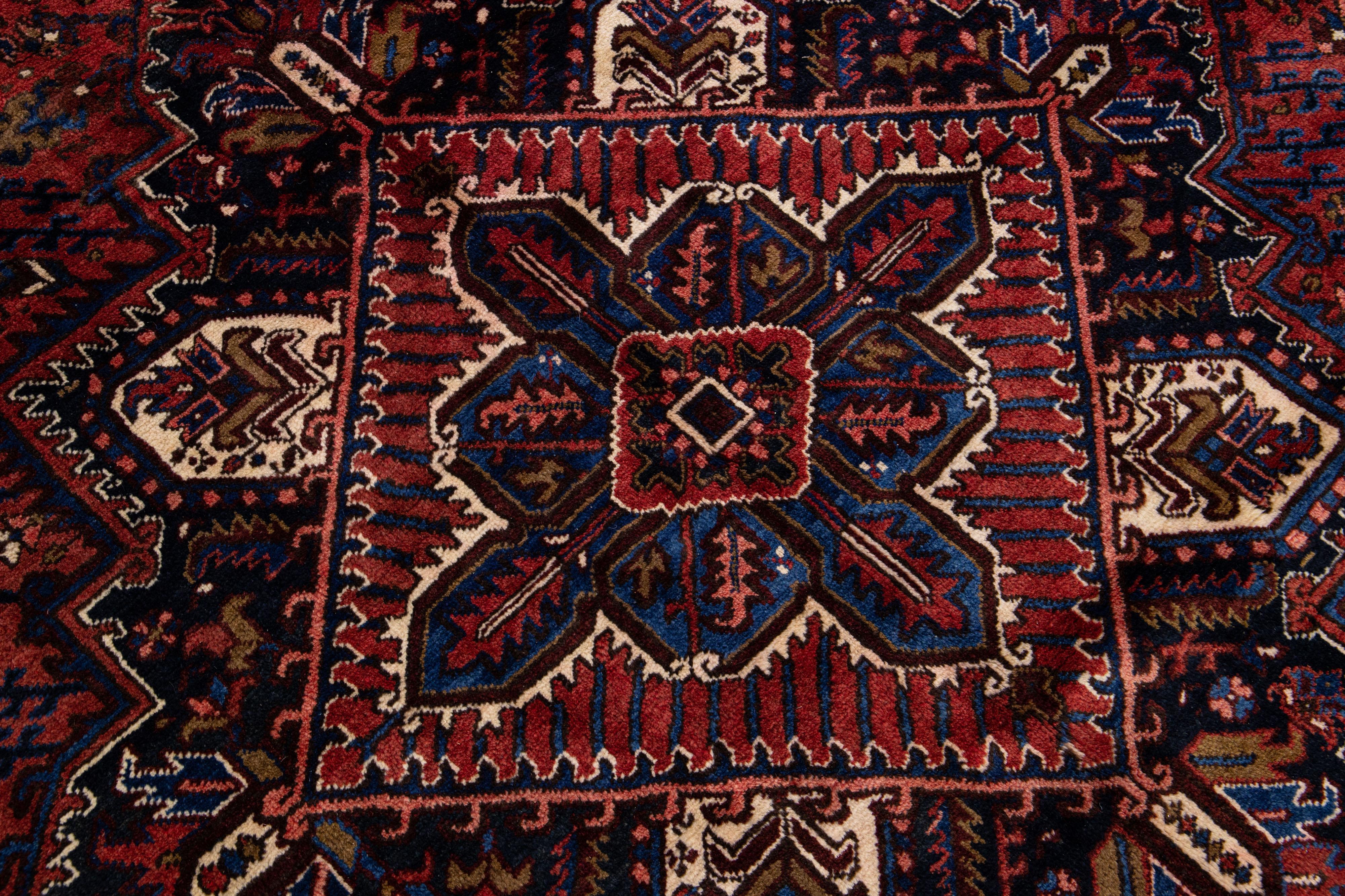 Early 20th Century Red Antique Persian Heriz Handmade Gallery Wool Rug with Medallion Motif For Sale
