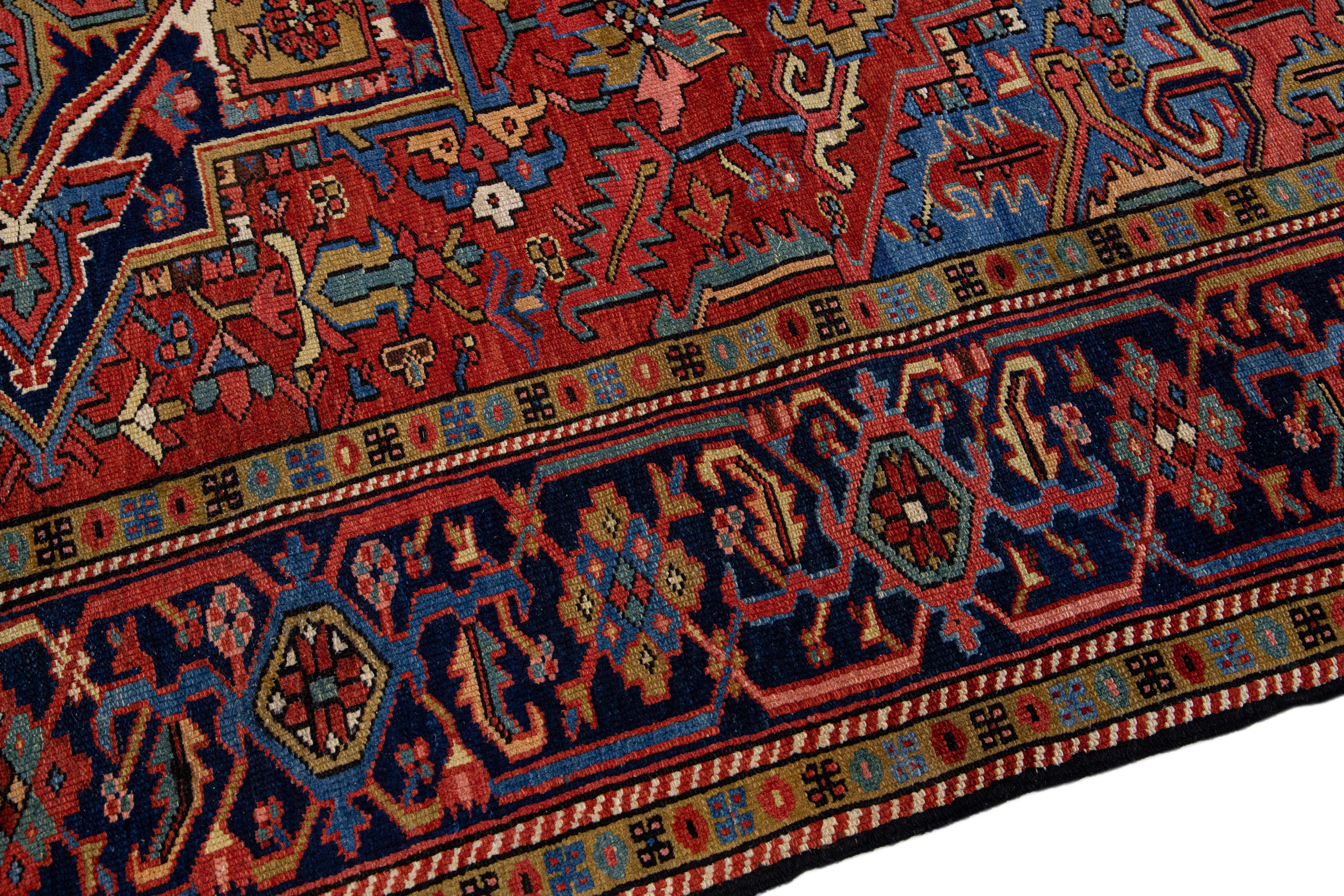 20th Century Red Antique Persian Heriz Handmade Wool Rug with Medallion Design For Sale