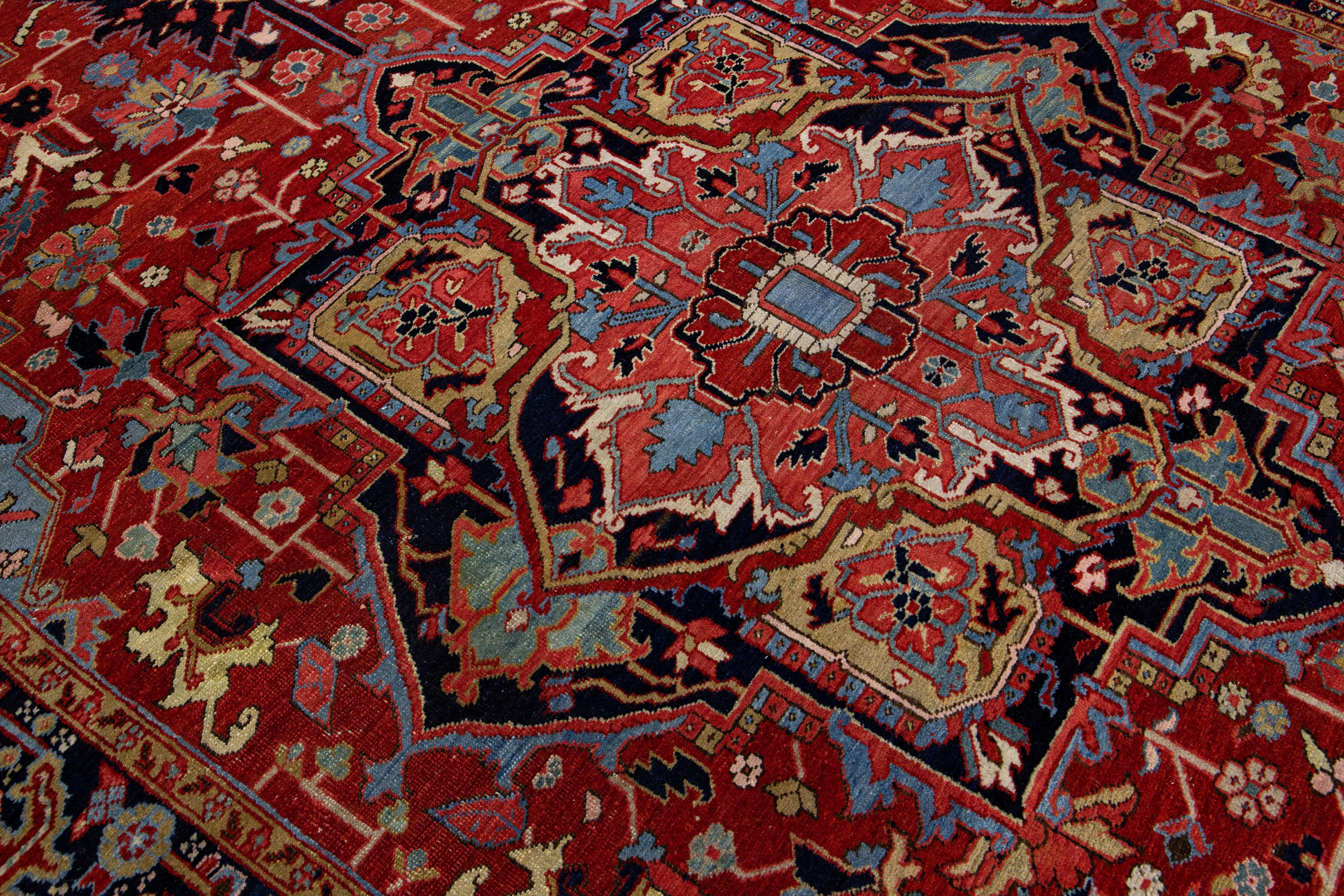 20th Century Red Antique Persian Heriz Handmade Wool Rug with Medallion Design For Sale