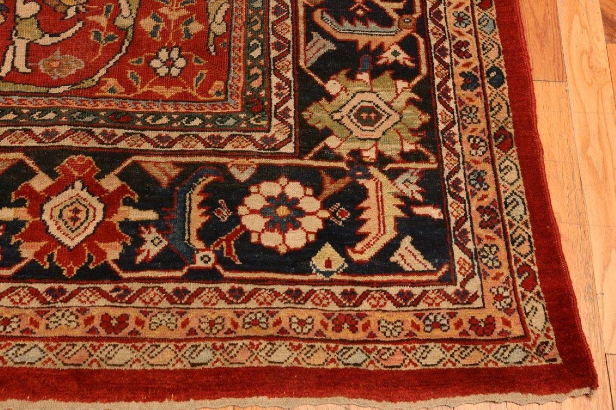 Red antique Persian Mahal Sultanabad rug, 13 ft 6 in x 10 ft (4.11 m x 3.05 m). Circa 1910'
Overall good condition with good pile throughout. Minor areas slightly lower in pile with minute use of tint. Sides are rebound and both ends are complete