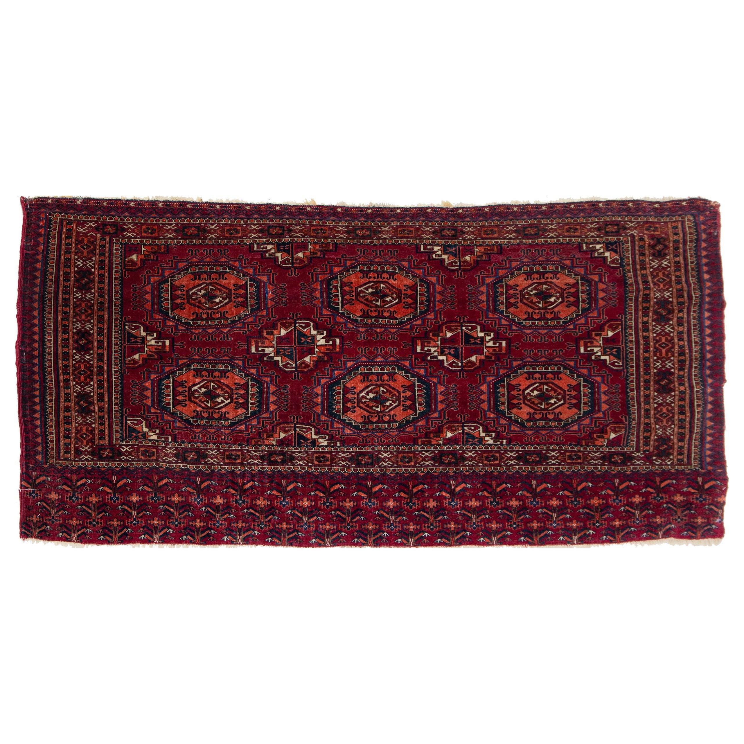 Tapis persan ancien en laine rouge à motif géométrique