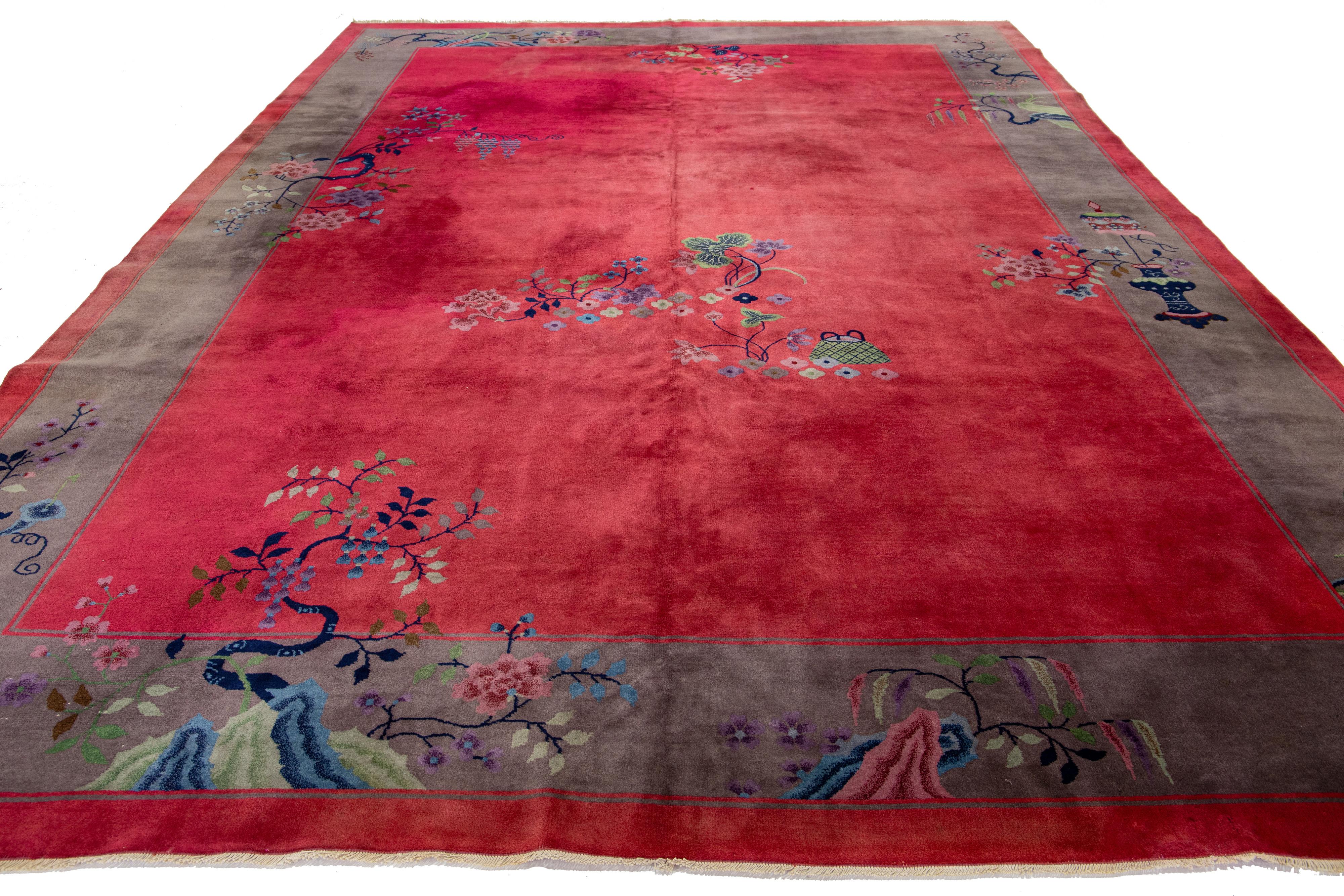 Antique Chinese Art Deco rug. Hand-knotted wool. Bold red background with Chinese floral design in multicolor hues.


This rug measures 9'8