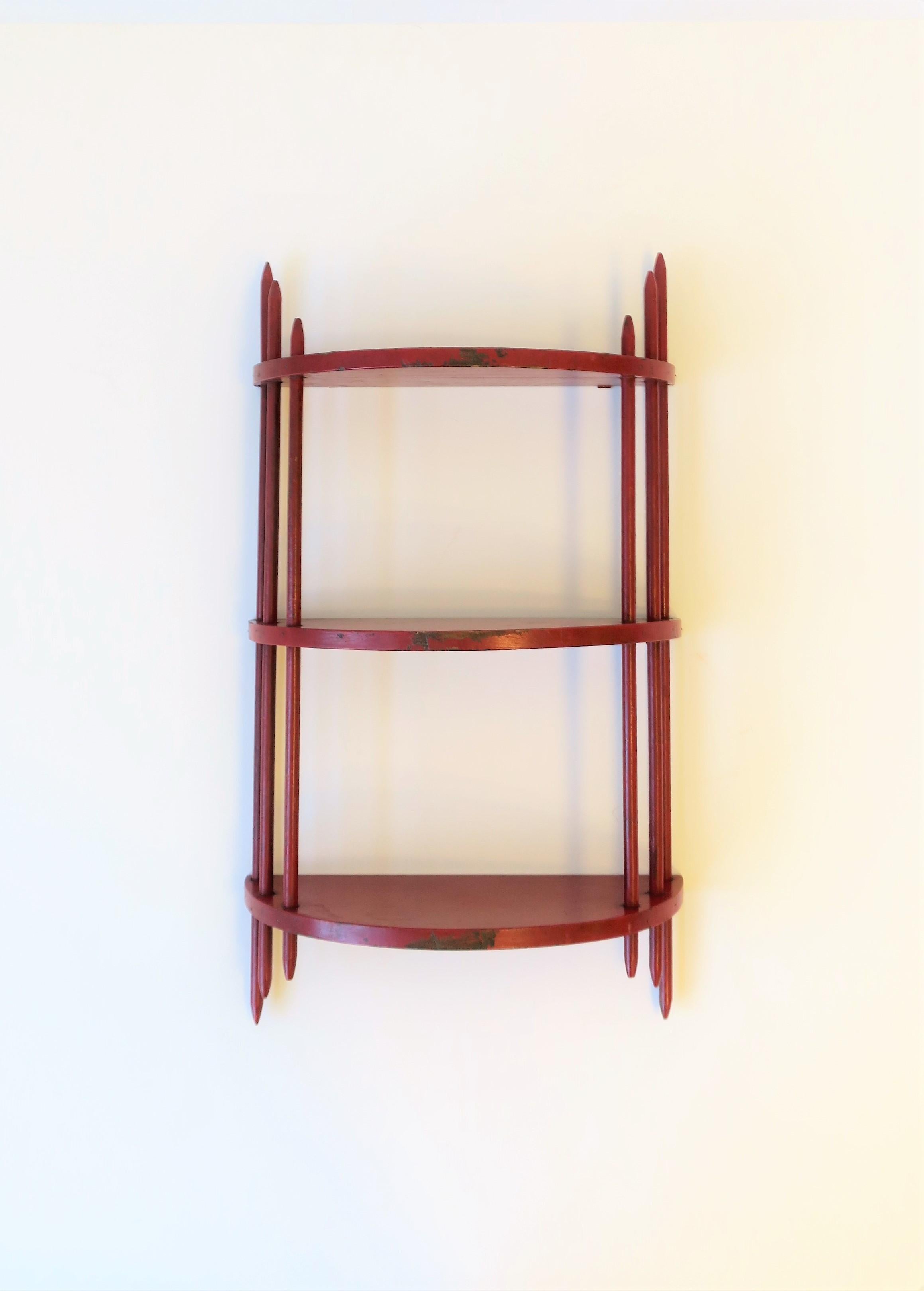 A great red lacquer hand painted Art Deco period wood wall shelf, circa 1930s. Demilune shape. Hooks on back for hanging. 

Shelf measures: 5.25