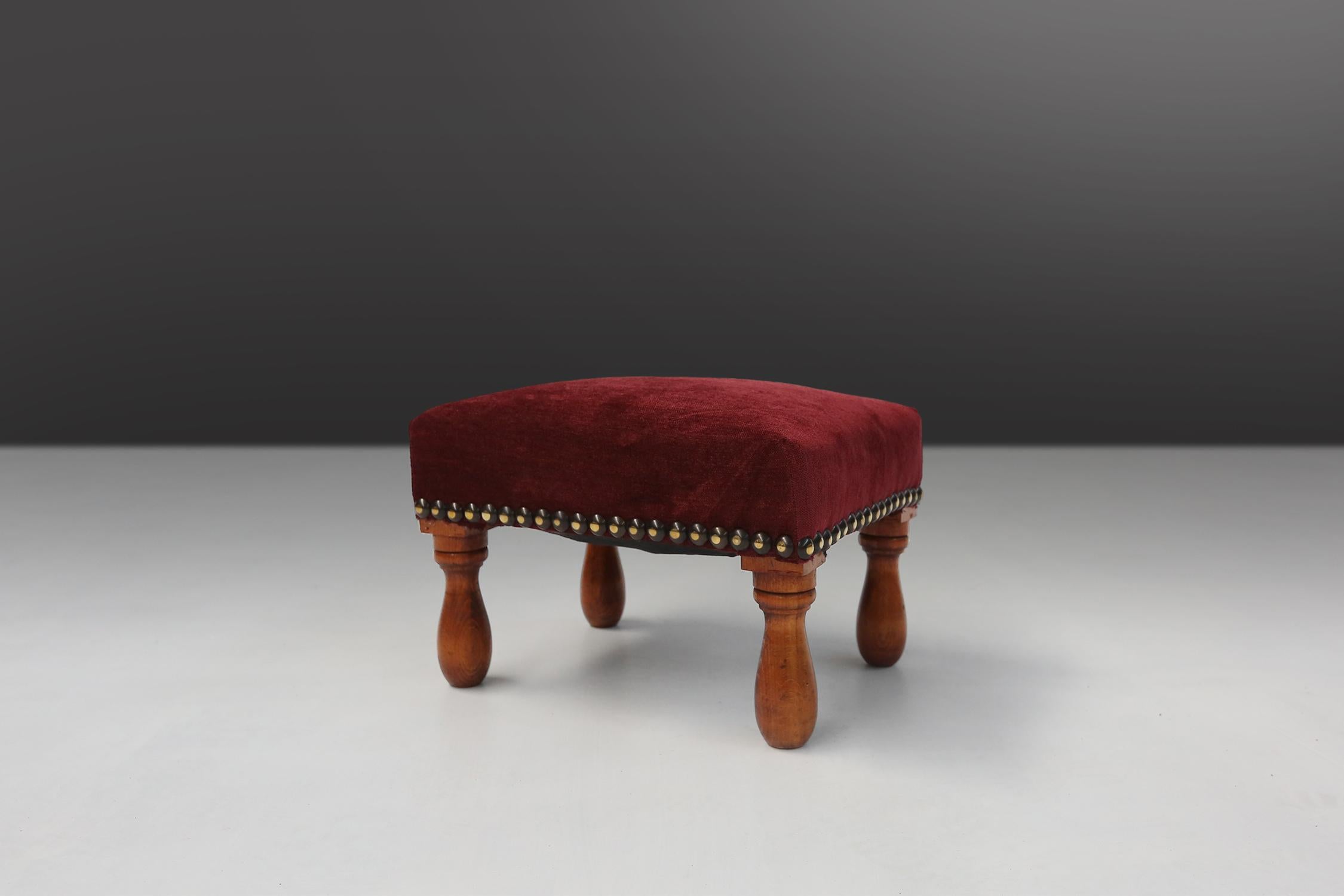 Red velvet Art Deco stool made around 1930. Fully reupholstered in red velvet and some nice turned legs.