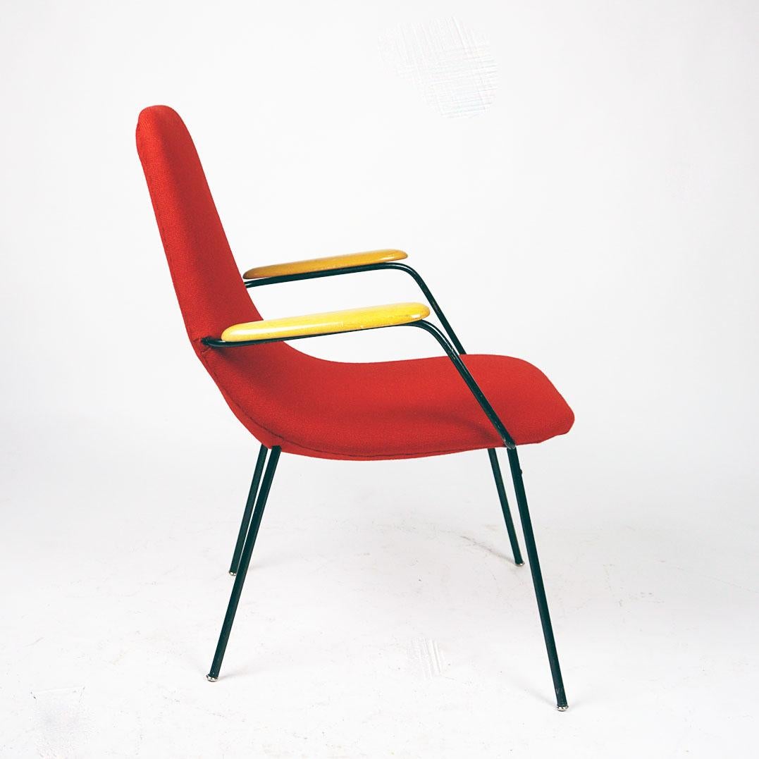 This nice and charming Lounge or club chair with tapering black lacquered metal legs was designed and made in Austria in the midcentury.  It features two bright beechwood armrests with a shell seat and its design is in the Style of Carl Auböcks