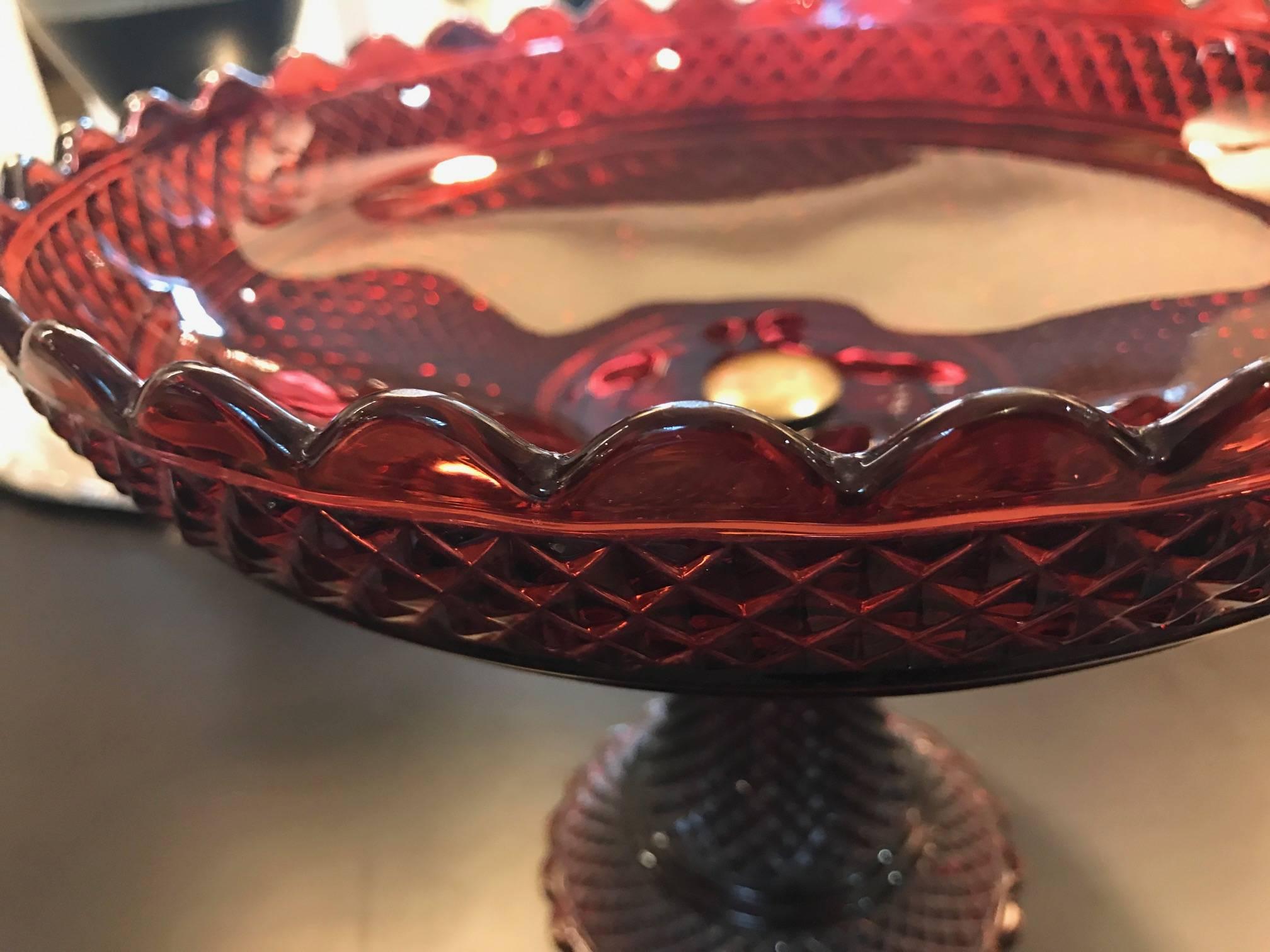 A beautiful signed Baccarat cranberry centre bowl with pedestal. The top is bolted to the bottom as characteristic of mid-19th century molded Baccarat. Each piece has the Baccarat name signed in block letters. Into The scalloped bowl with diamond