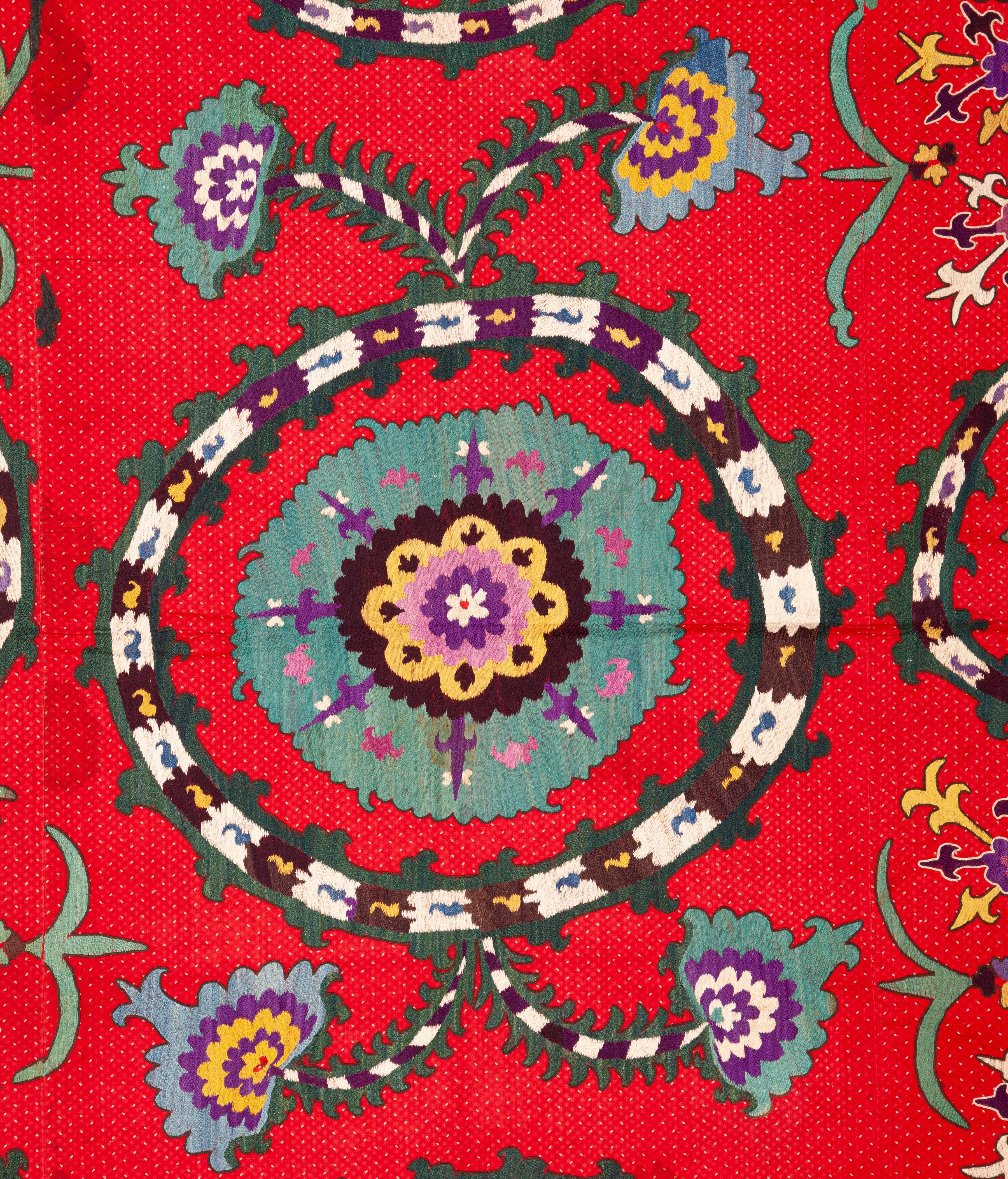 It is an unusual example since it is embroidered on a red color Russian printed textile. The embroidery is at its best on this very piece. In rather good condition except some staining that does not hurt the eye in the room light.
 