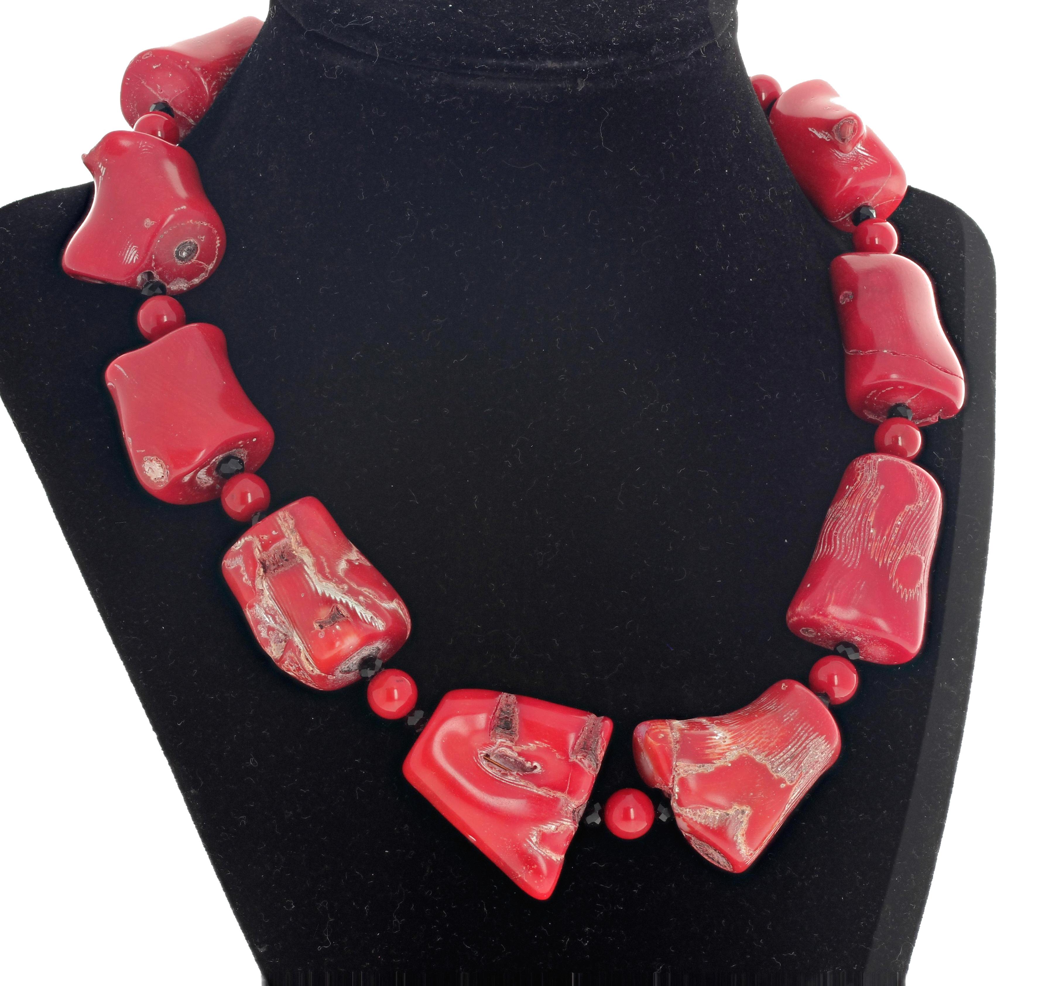 Gorgeous polished chunks of natural red Bamboo Coral enhanced with polished natural red coral and sparkling real natural little black Spinels gemstones set in an 18 inch long necklace with gold tone hook clasp.  This very dramatic on a sweater !