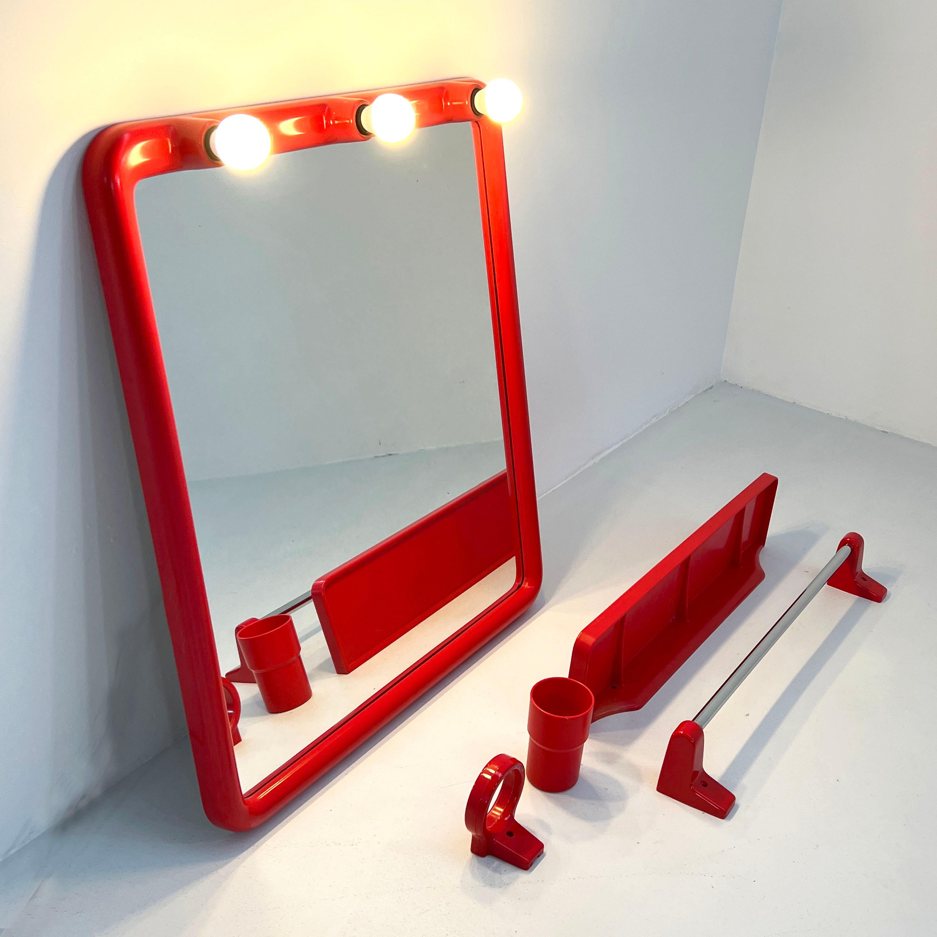 Producer - Carrara & Matta
Design Period - Seventies 
Measurements - Width 60 cm x Depth 12 cm x Height 70 cm
Materials - Plastic, mirror
Color - Red
Condition - Good 
Comments - Light wear consistent with age and use. One chip at the bottom