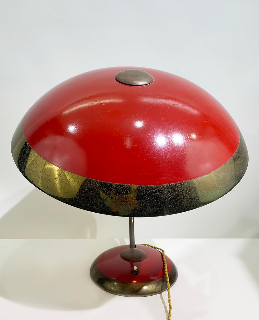 Original unrestored Bauhaus desk/table lamp by Helo Leuchten.
Beautiful red exterior with brass accents. 
Can be delivered and wired for American or European use.