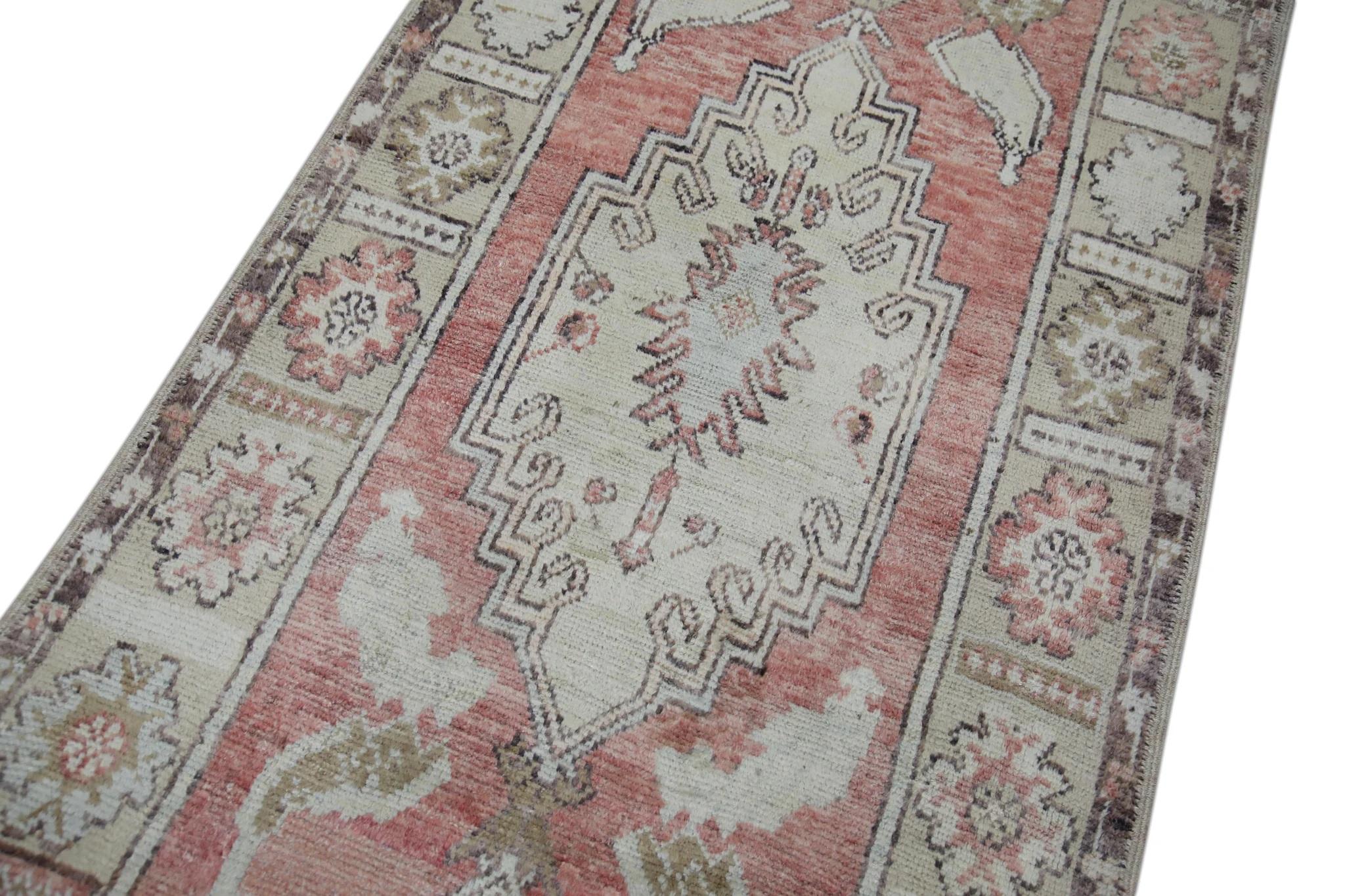 Introducing a one-of-a-kind vintage Turkish hand-knotted wool rug, carefully crafted by skilled artisans using traditional techniques passed down through generations. This exquisite rug boasts a stunning array of natural dyes, resulting in a rich