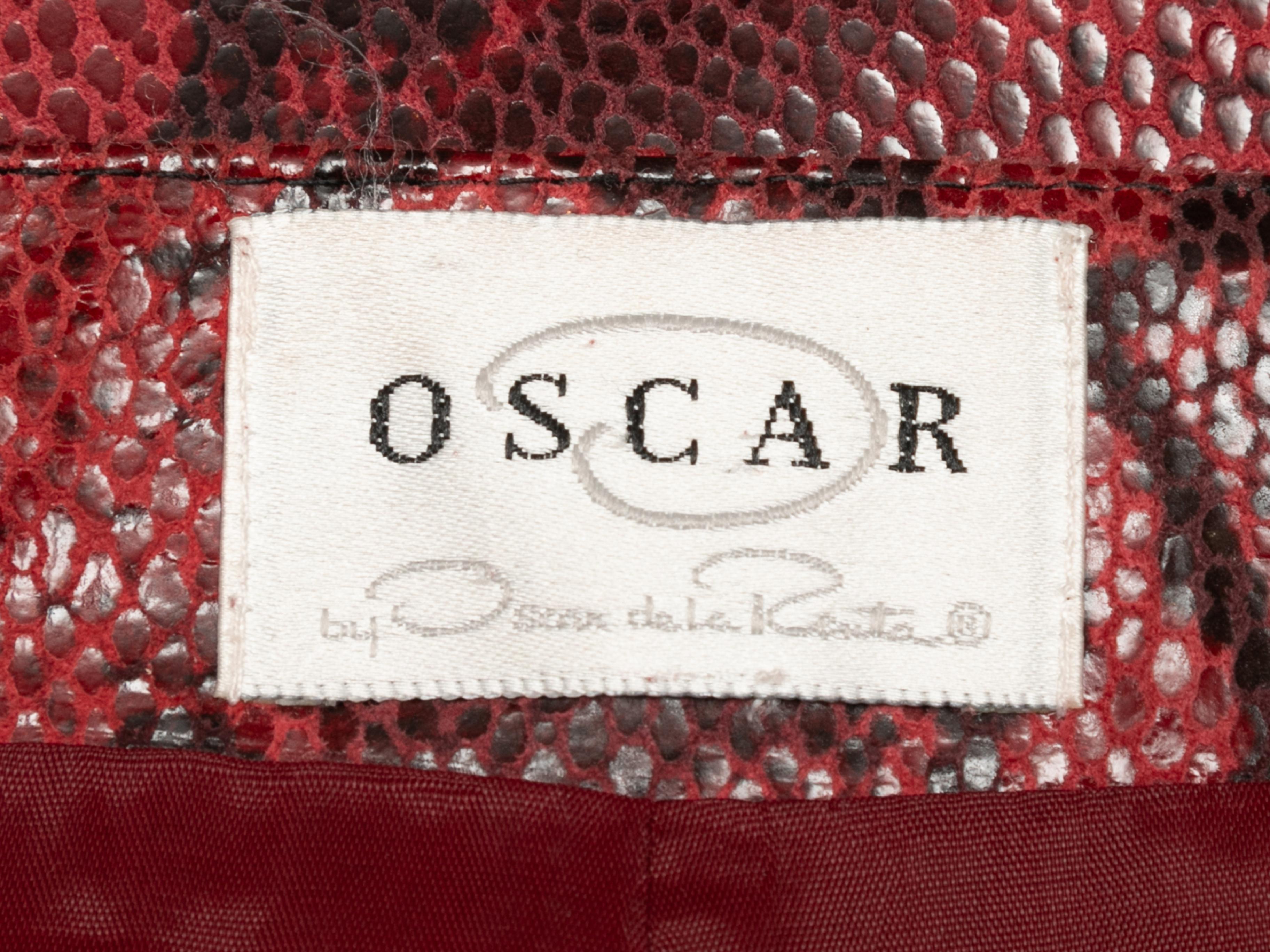 Red and black faux snakeskin skirt by Oscar de la Renta. Zip closure at back. 32