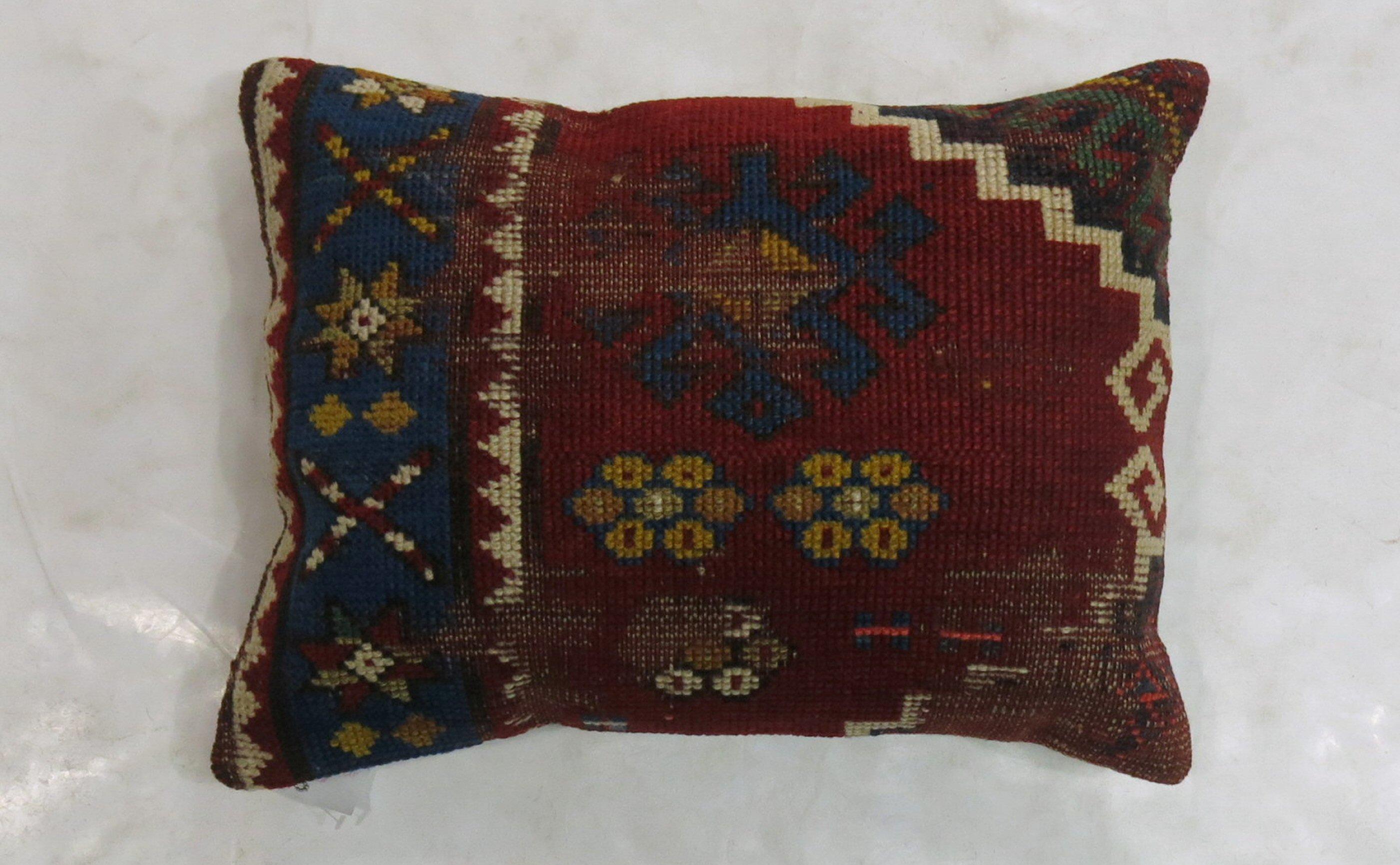 Lumbar size pillow made from a 19th-century Caucasian rug. 

Measures: 14