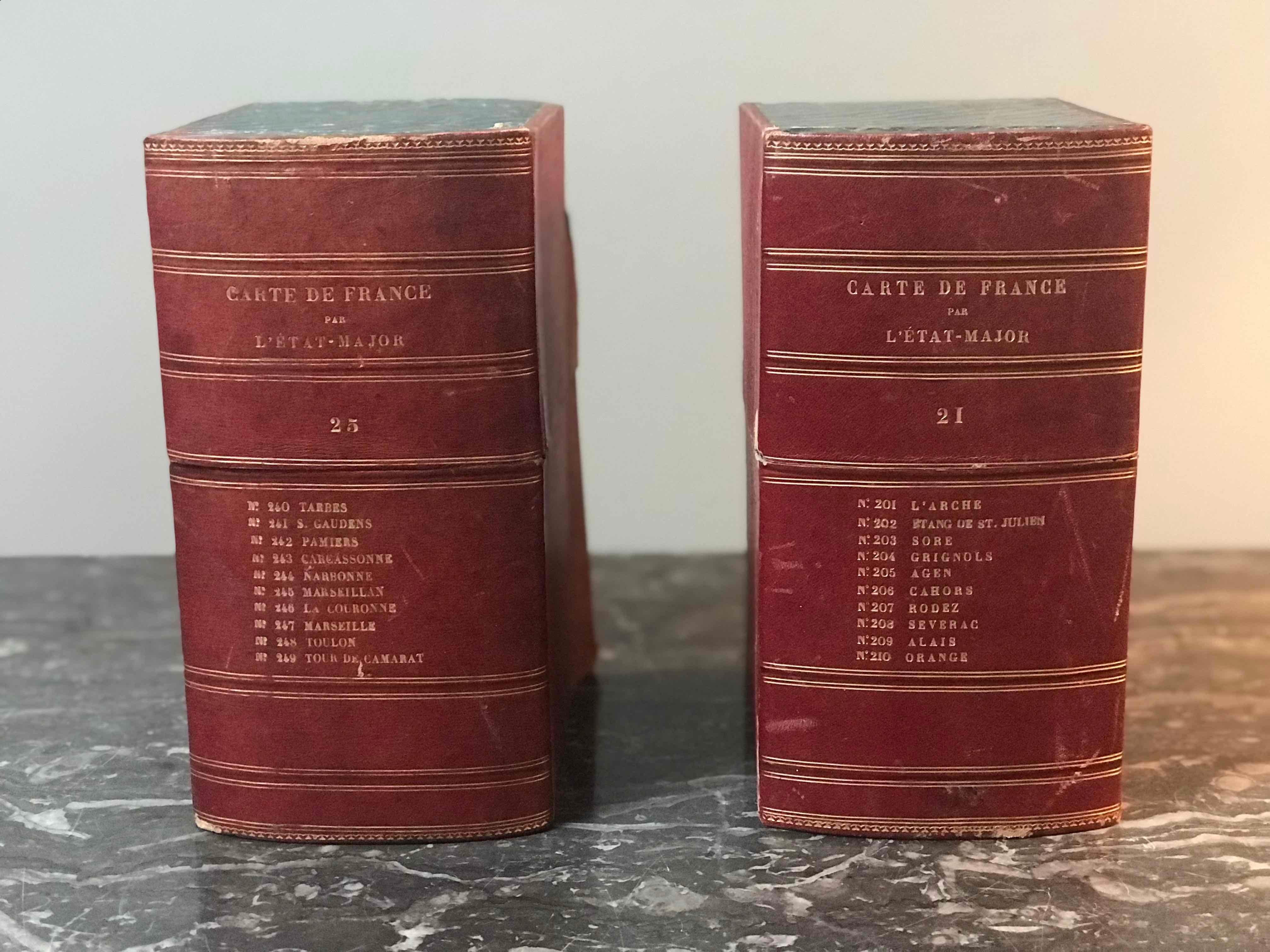 Red leather and gold embossed book boxes with beautiful blue interiors. Great for filling out a bookshelf or display case while surreptitiously providing additional storage, this handsome set makes for a clever piece of tromp l'ceil. 22 available.