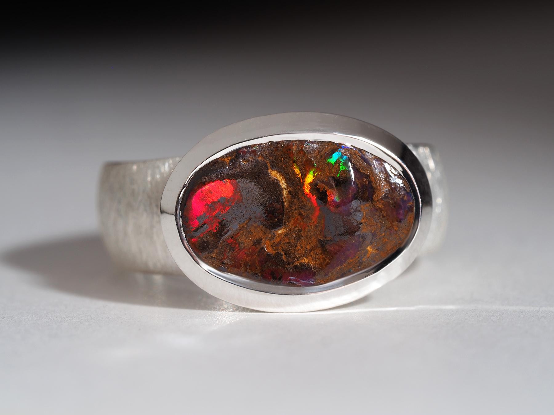 Statement silver ring with very bright, unique natural Boulder Opal of 4.21 carats with the rarest color of opalescence - red
Opal origin - Australia
color of opalescence - red, blue, green, orange
Opal measurements 9 x 14 mm
weight of the ring - 7