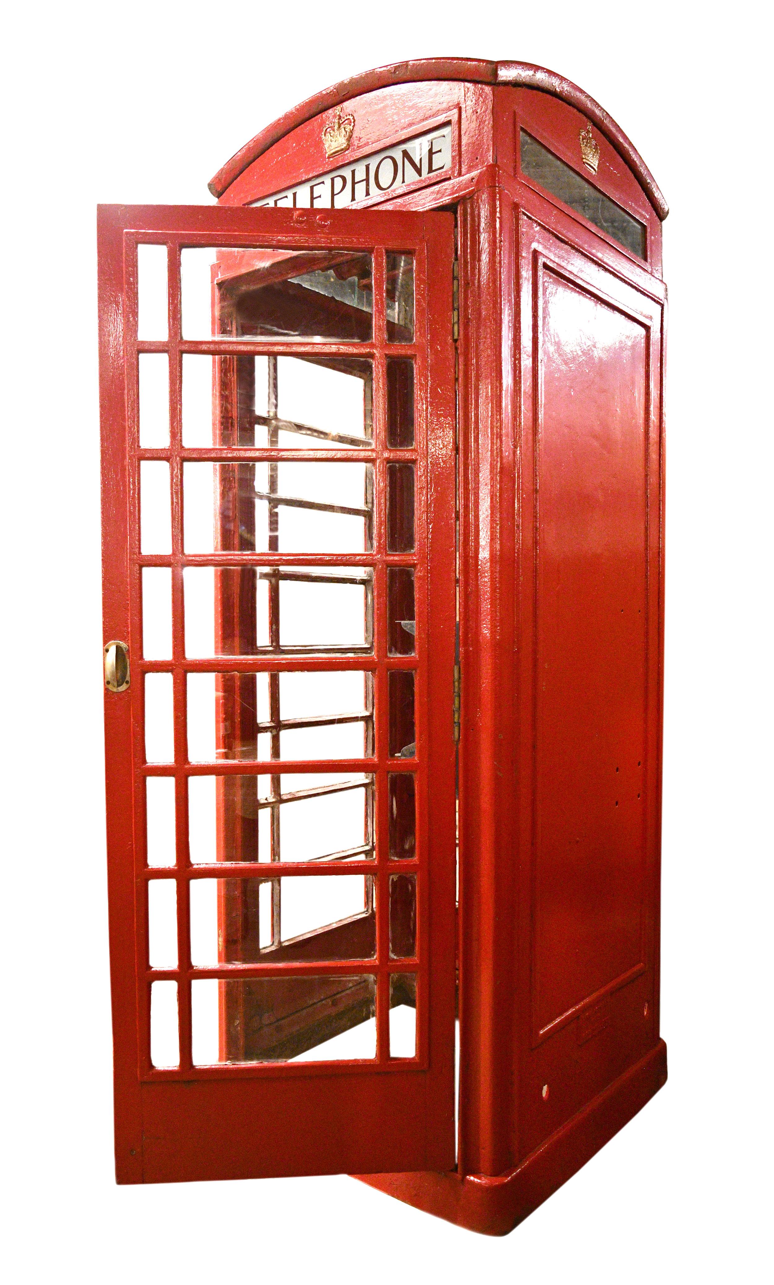 This authentic red K6 telephone booth is made of sturdy cast iron and was once in operation overseas in Middlesbrough, England. The red telephone box, a telephone kiosk for a public telephone designed by Sir Giles Gilbert Scott, was a familiar sight