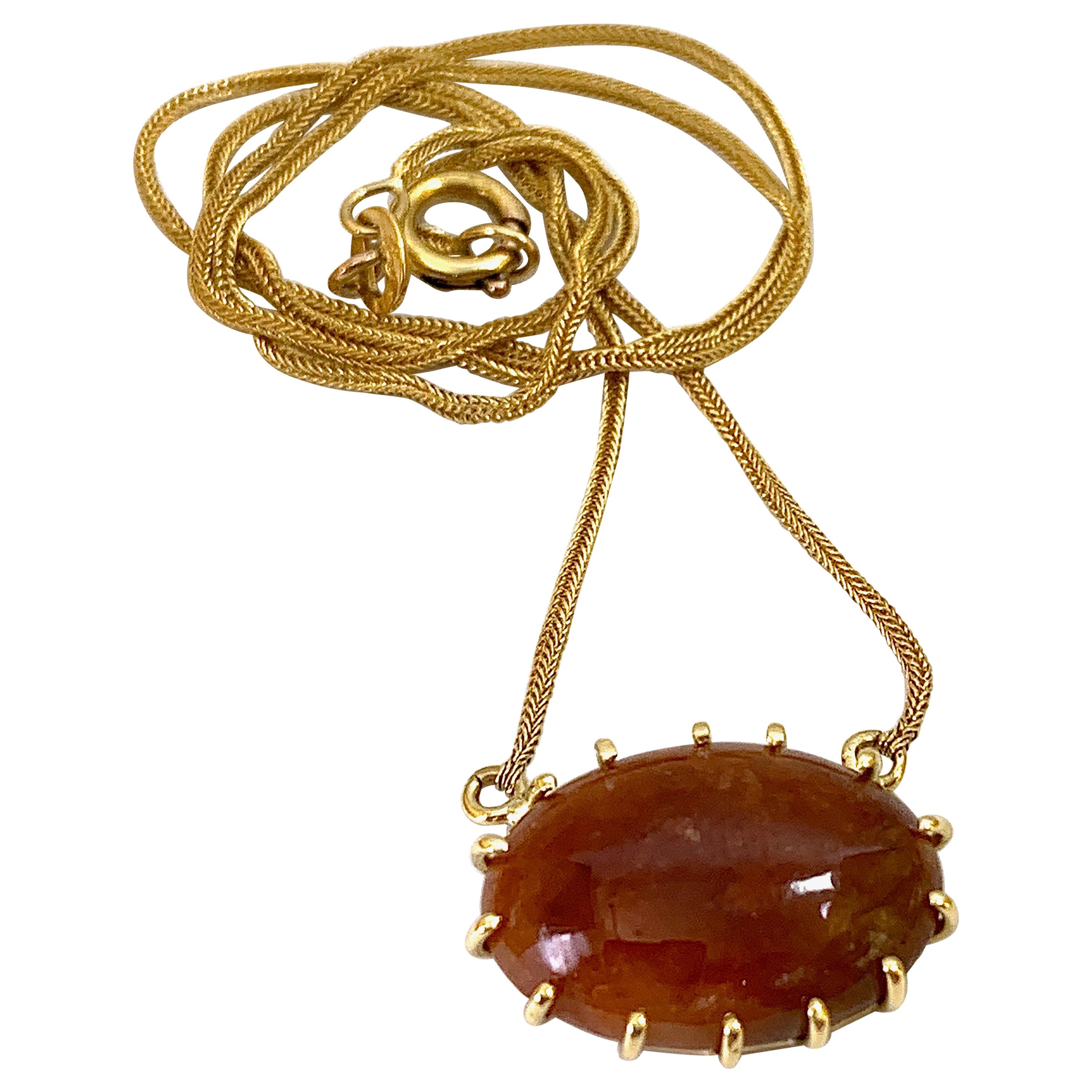 Red-Brown Jadeite Cabochon Pendant on Snake Chain in 18 Karat Yellow Gold