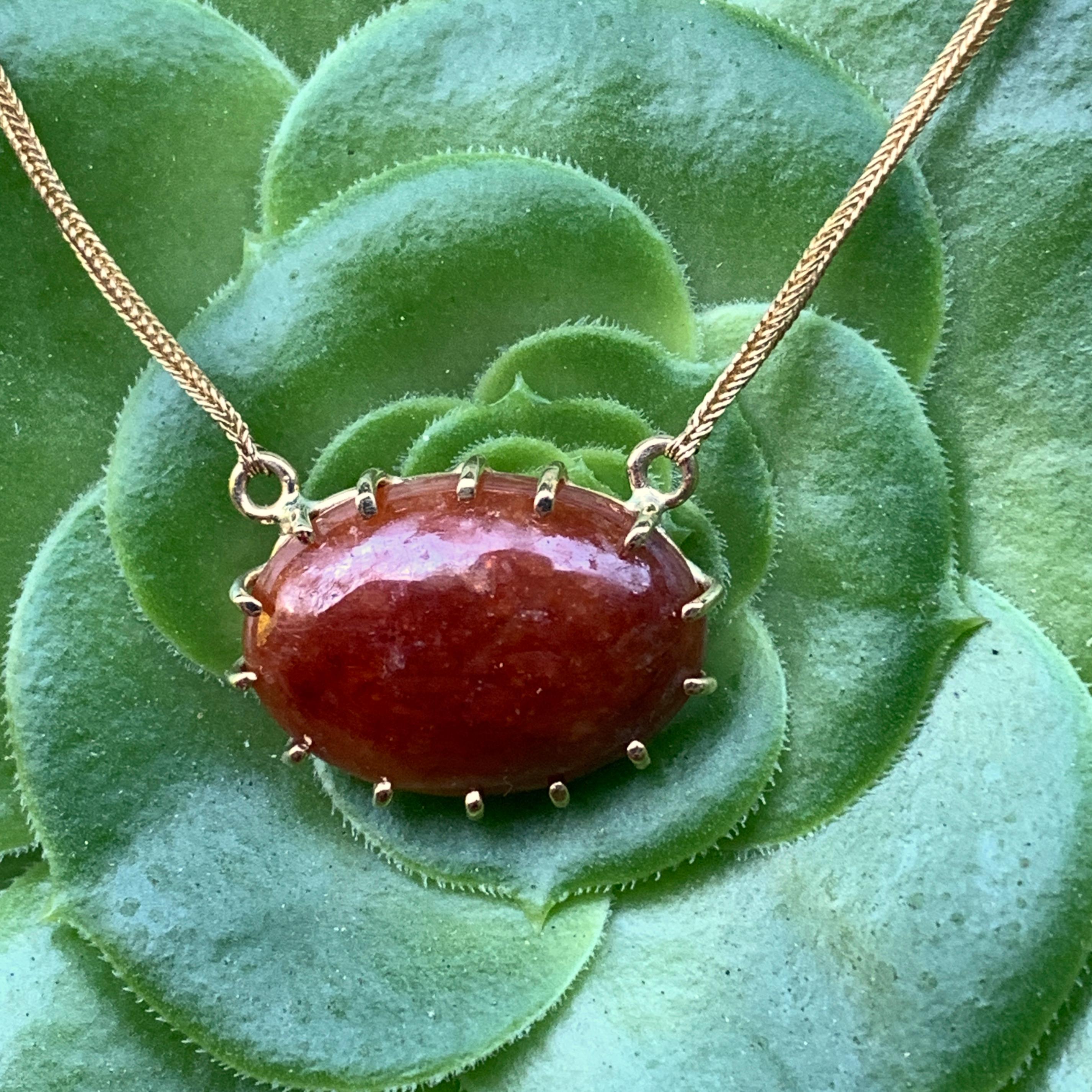 Contemporary Red-Brown Jadeite Cabochon Pendant on Snake Chain in 18 Karat Yellow Gold