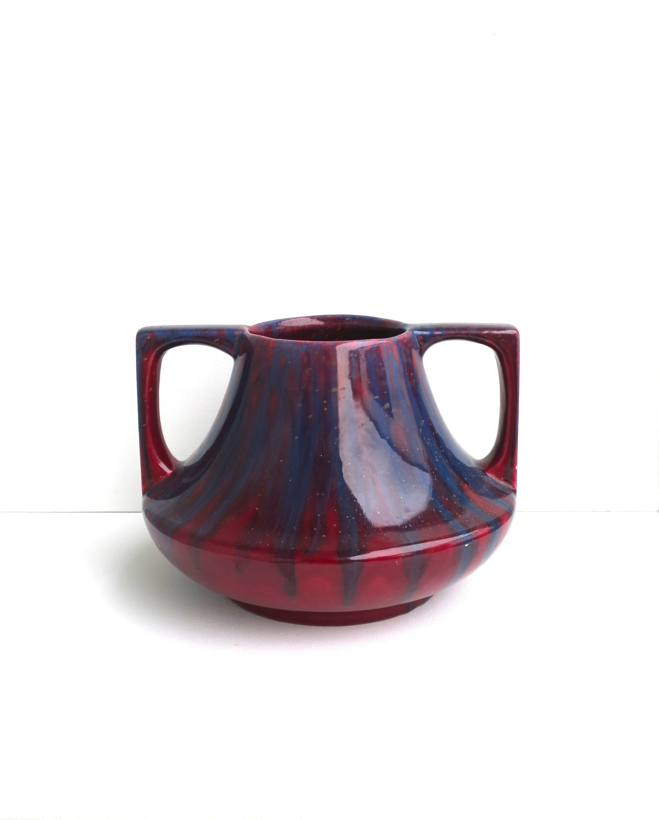 A red burgundy and blue ceramic drip glazed amphora vase, circa mid-20th century. A beautiful standalone piece for a shelf, credenza/sideboard, etc., with rich red burgundy and blue hues. Dimensions: 8