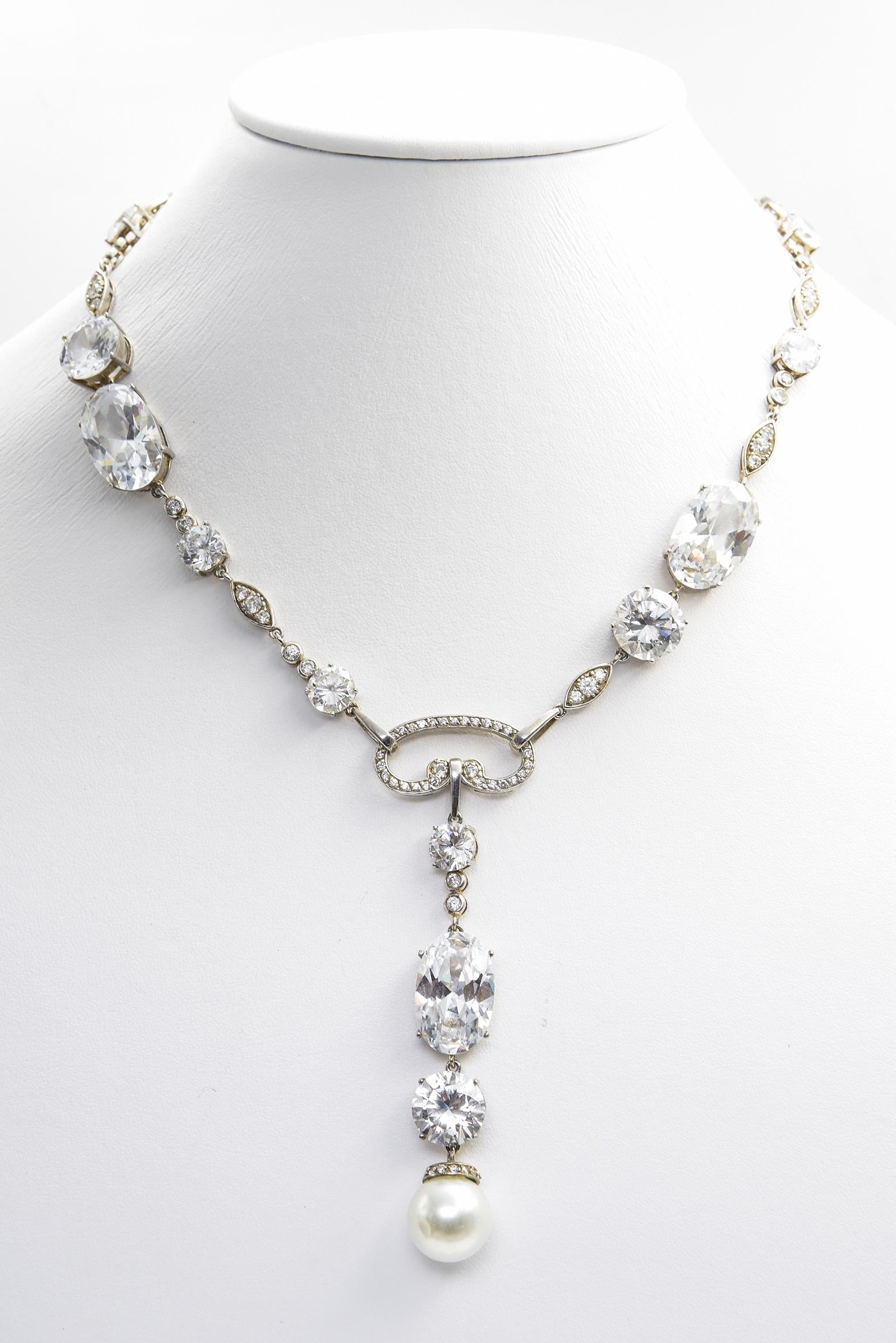 Impressive sterling silver necklace featuring a mixture of large prong set round and oval CZs accented by smaller bezel set CZ crystals and CZs in navette shaped links in the top 16