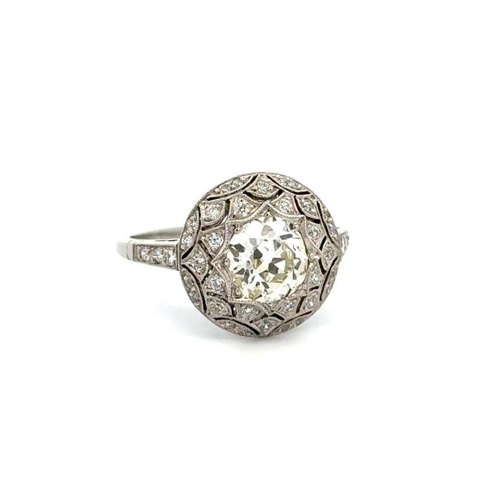 Simply Beautiful Show Stopper! Finely detailed Old European Cut Diamond Statement Circular Platinum Cocktail Ring. Centering a securely nestled Hand set 1.21 Carat Old European Cut Diamond. Surrounded by OEC Diamonds, weighing approx. 0.54tcw. Hand