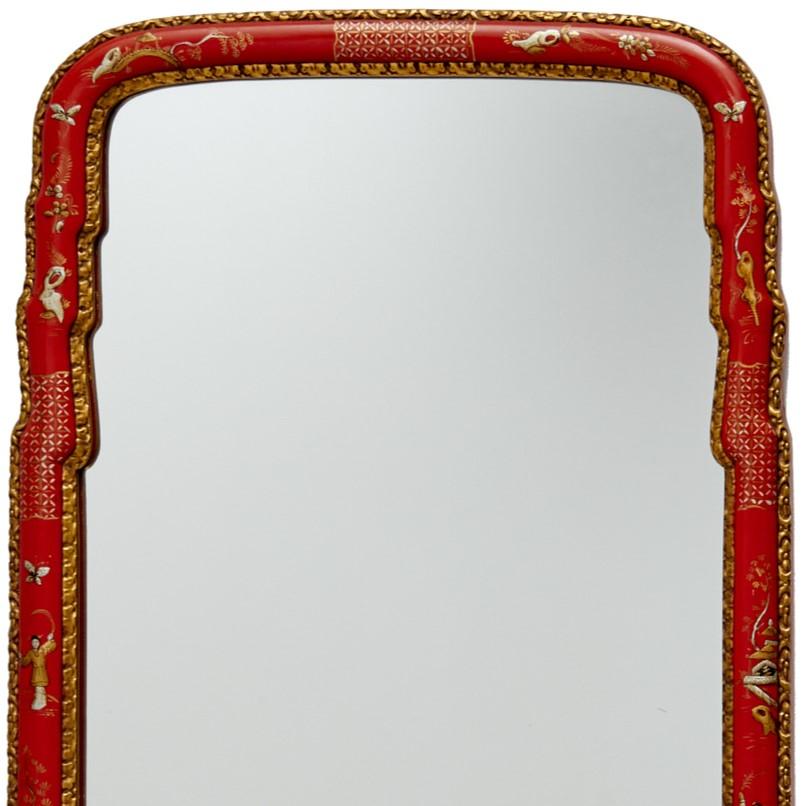 Late 20th c. American, Carvers' Guild Queen Ann Mirror #5494C. Exquisite silver and gold raised chinoiserie is hand painted on an antique red ground with a border detail of hand gilded antique gold leaf. The mirror is decorated with figures,