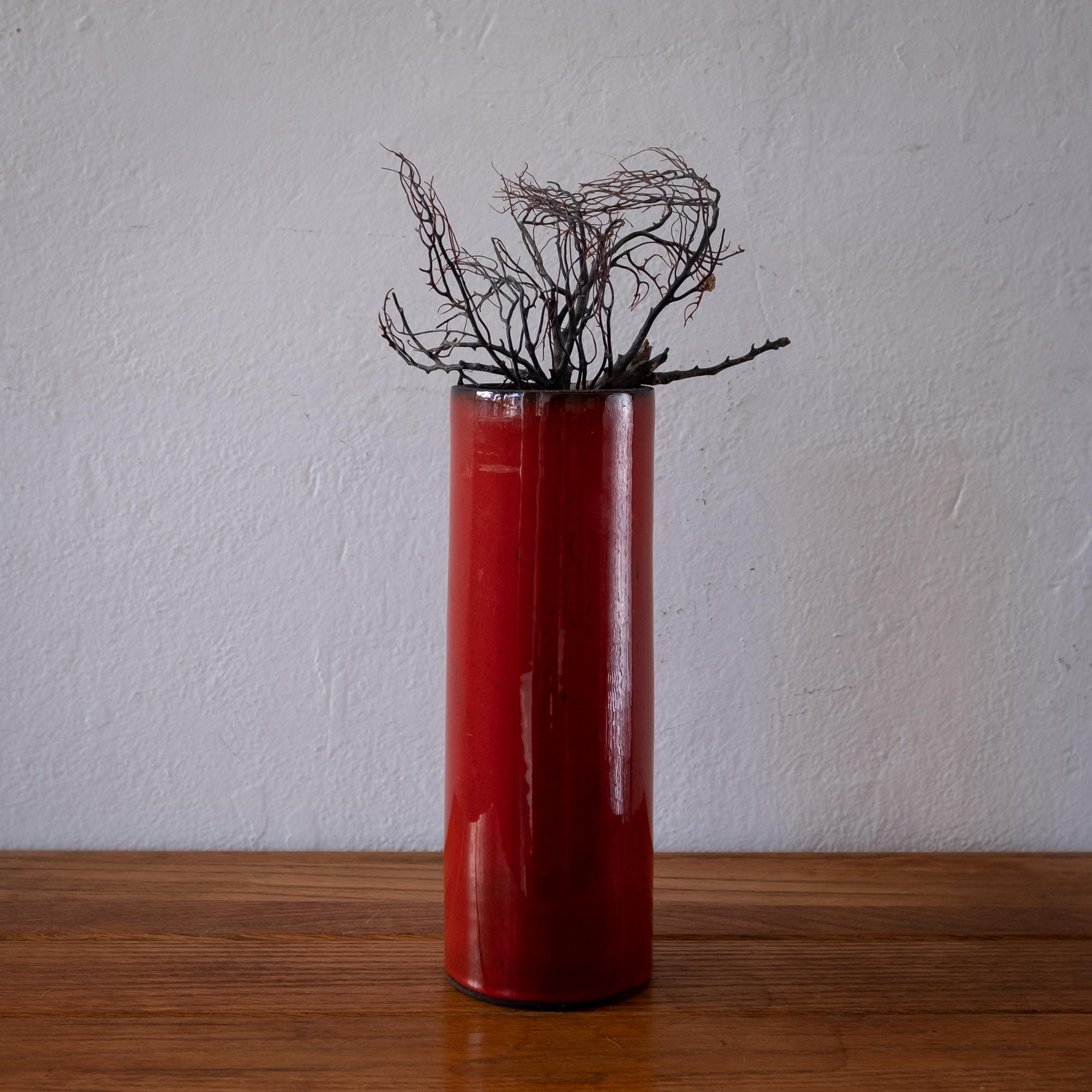 Glazed ceramic cylinder vase. Underside incised with illegible artist’s signature. Reminiscent of work by Georges Jouve. France, 1950s